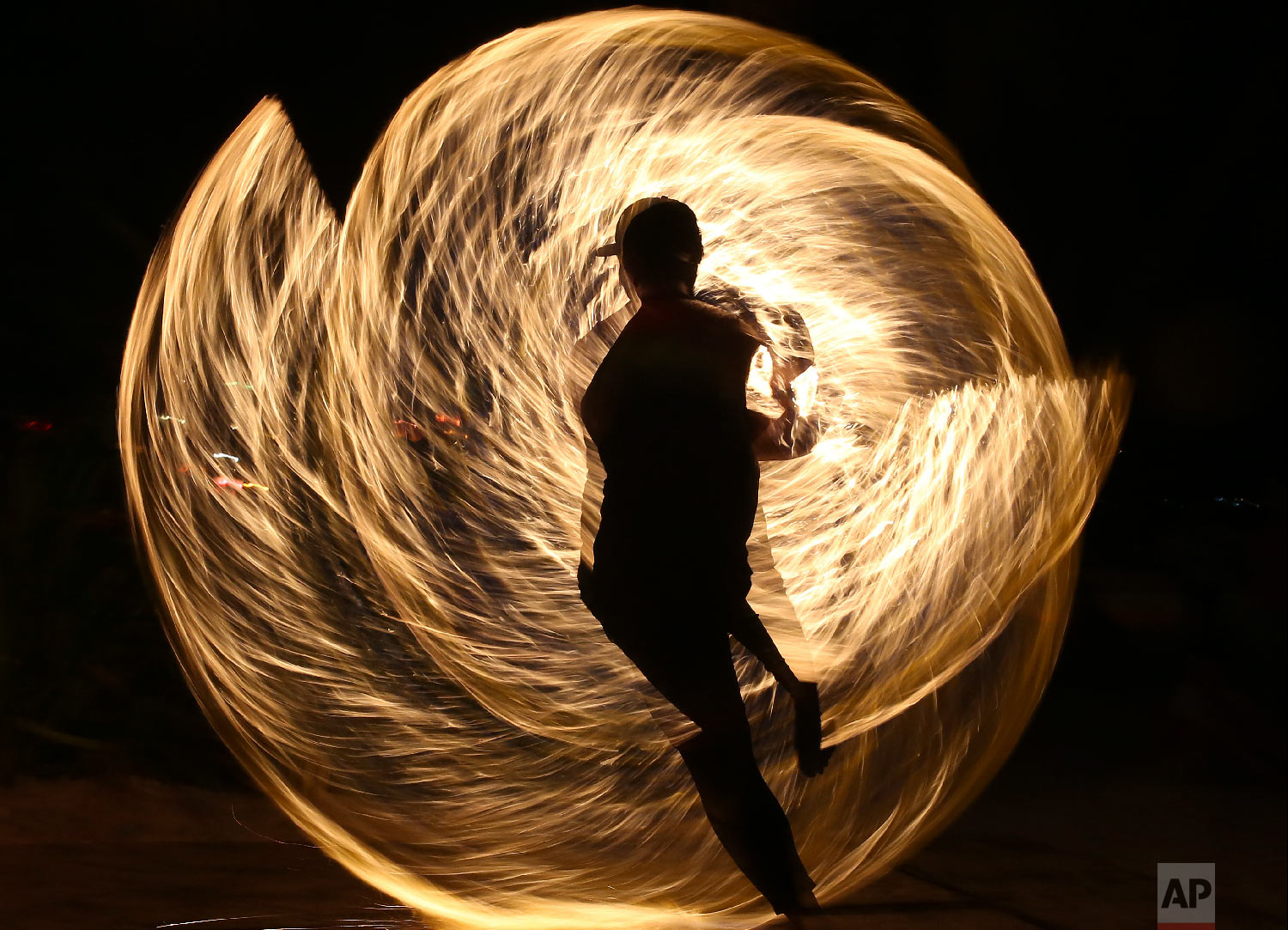  A Filipino fire dancer performs for the last time a day before the government implements the temporary closure of the country's most famous beach resort island of Boracay, in central Aklan province, Philippines, on Wednesday, April 25, 2018. Tourist