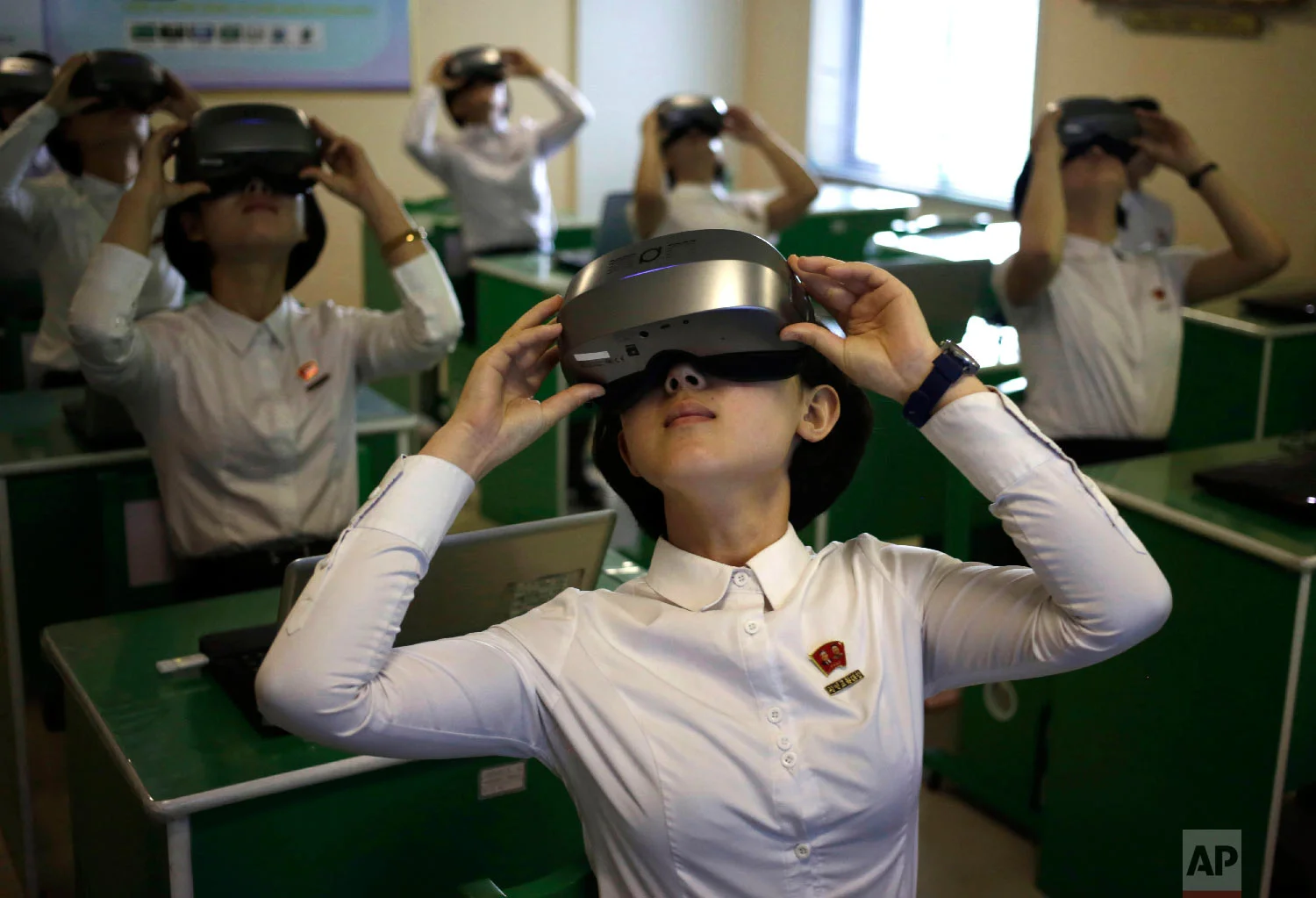 Students wear virtual reality goggles during a science class at Pyongyang Teachers' University, a teacher training college, in Pyongyang, North Korea Thursday, June 14, 2018. (AP Photo/Dita Alangkara)