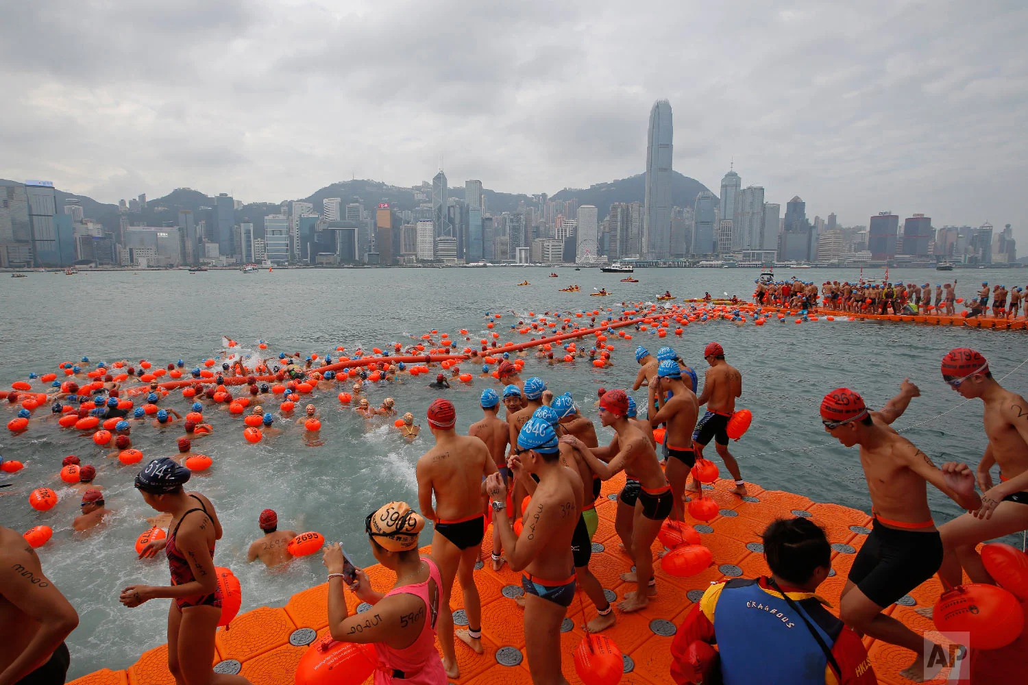 Competitors swim during the annual harbor race at the Victoria Harbour in Hong Kong, Sunday, Oct. 21, 2018. Thousands of swimmers took part in the Hong Kong's iconic cross harbor race. (AP Photo/Kin Cheung)