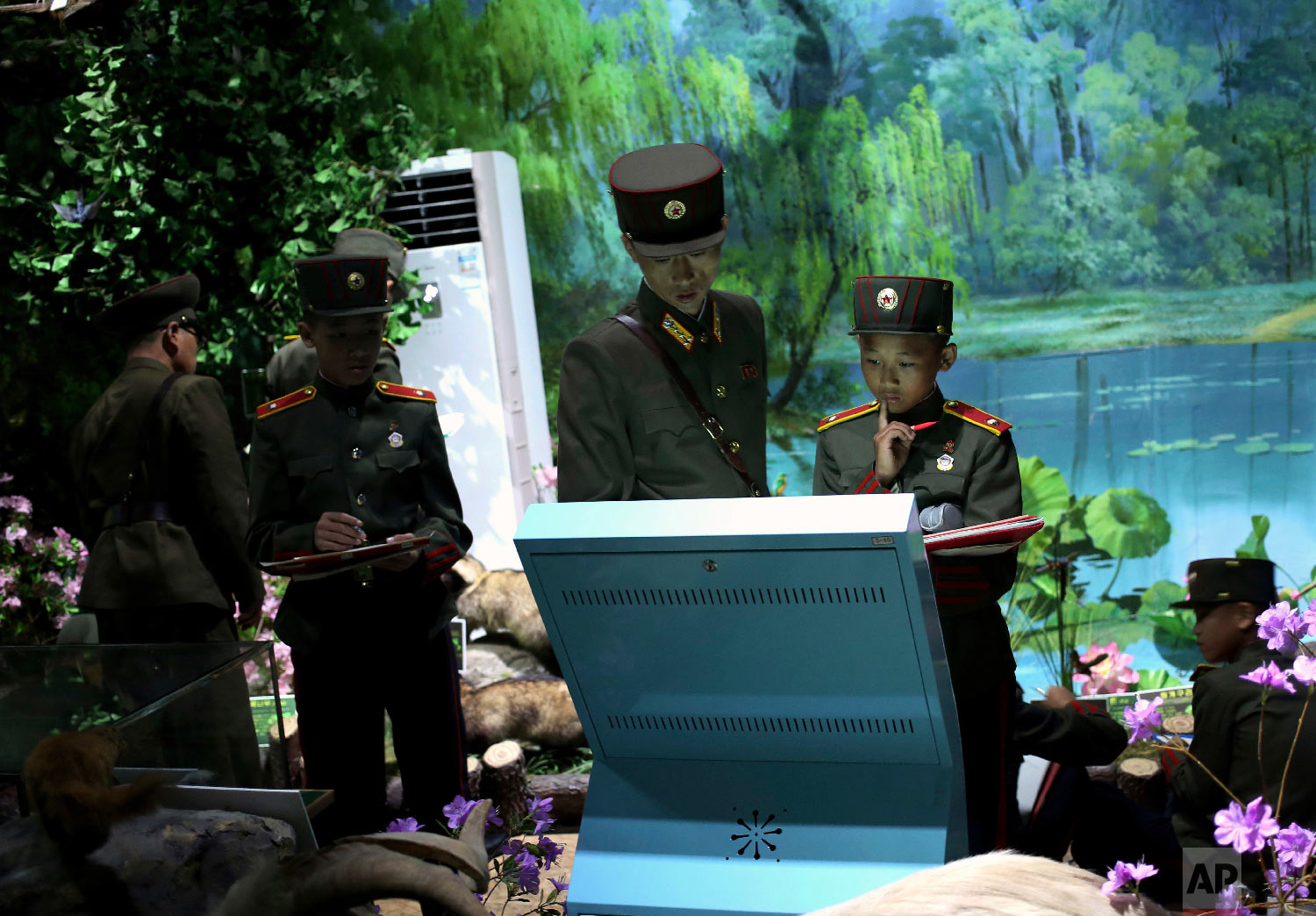  A student and his teacher look at a computer screen during a biology class at Mangyongdae Revolutionary School, an elite military educational establishment, in Pyongyang, North Korea, Thursday, June 21, 2018. The school provides basic all-round educ