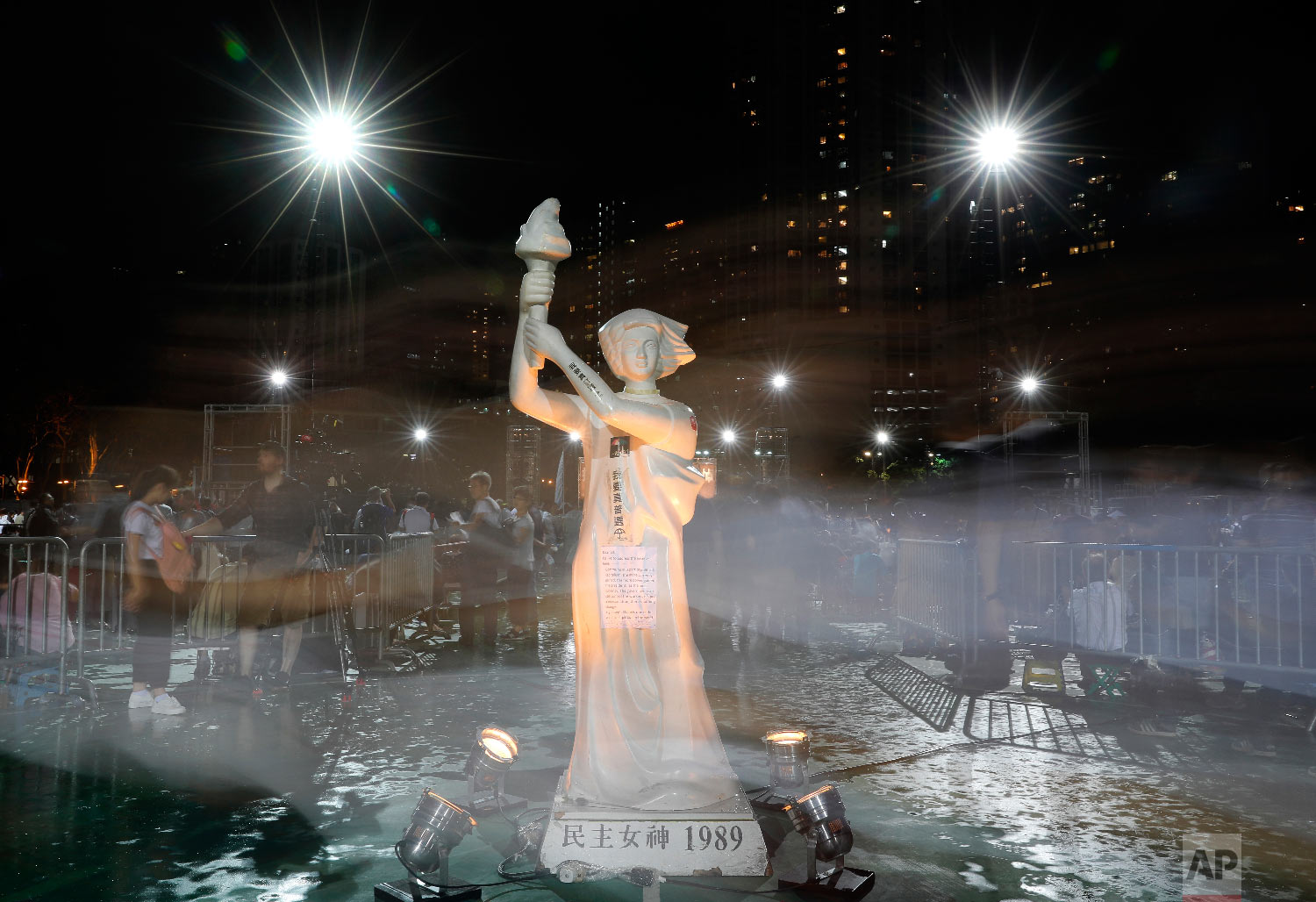  A statue of the "Goddess of Democracy" is displayed as tens of thousands of people attend an annual candlelight vigil at Hong Kong's Victoria Park, Monday, June 4, 2018. Hong Kongers commemorate victims of the Chinese government's brutal military cr