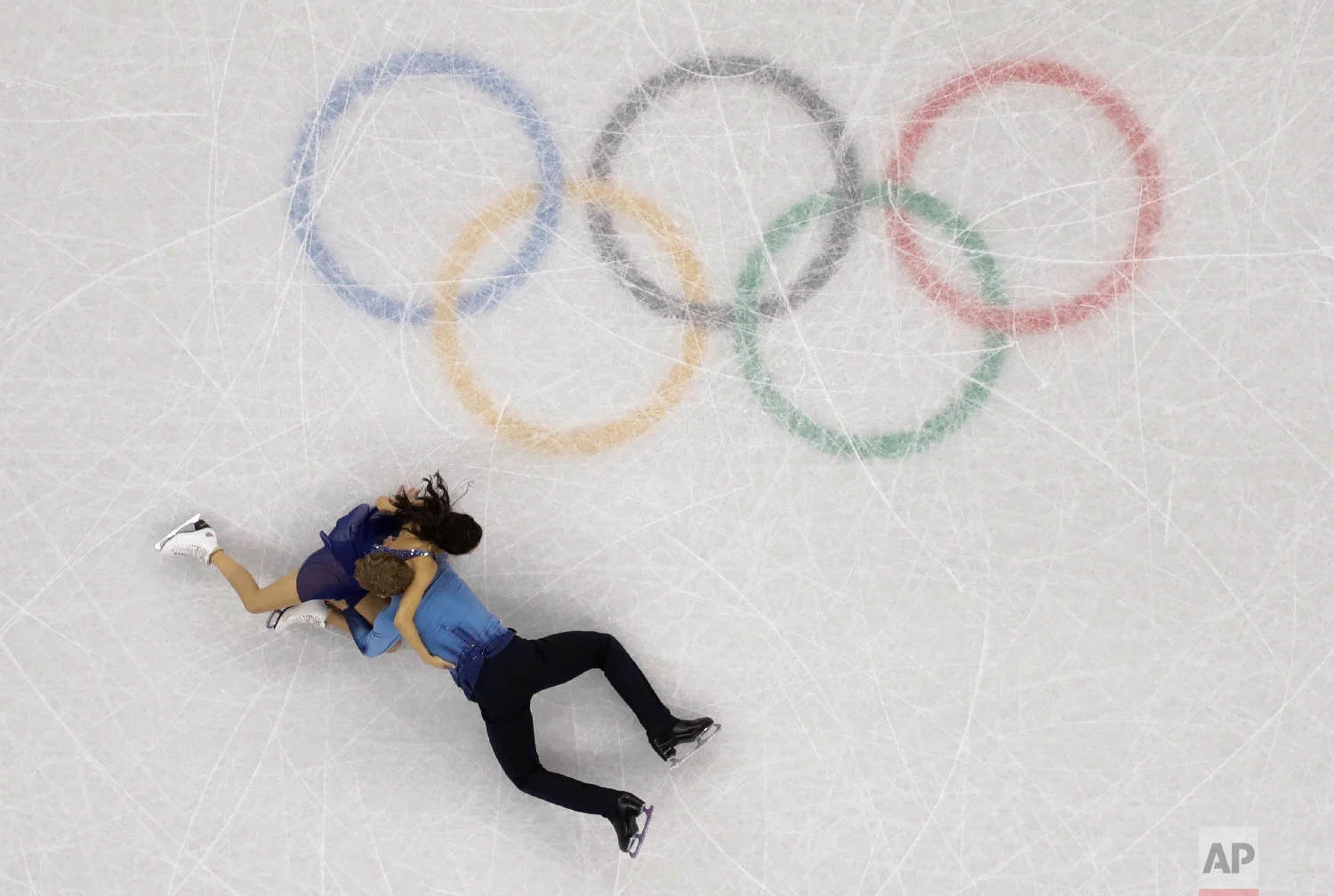 Madison Chock and Evan Bates of the United States fall during the ice dance, free dance figure skating final in the Gangneung Ice Arena at the 2018 Winter Olympics in Gangneung, South Korea, Tuesday, Feb. 20, 2018. (AP Photo/Morry Gash)
