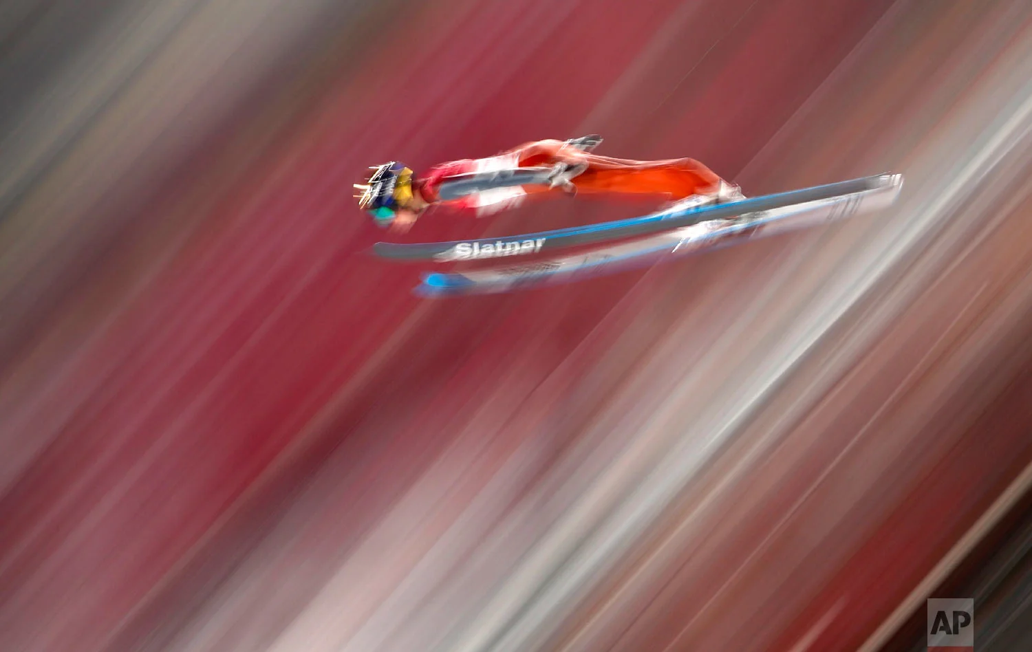 Tilen Bartol, of Slovenia, soars through the air during qualification for the men's large hill individual ski jumping competition at the 2018 Winter Olympics in Pyeongchang, South Korea, Friday, Feb. 16, 2018. (AP Photo/Matthias Schrader)