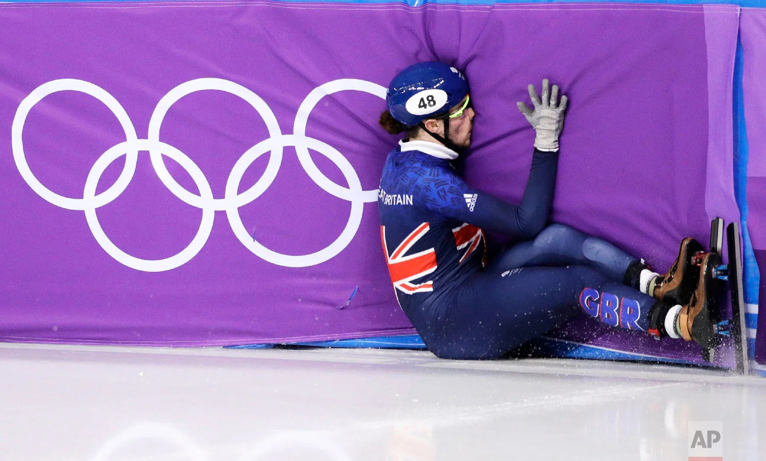 Farrell Treacy of Great Britain crashes during the men's 1500 meters in the Gangneung Ice Arena at the 2018 Winter Olympics in Gangneung, South Korea, Saturday, Feb. 10, 2018. (AP Photo/David J. Phillip)
