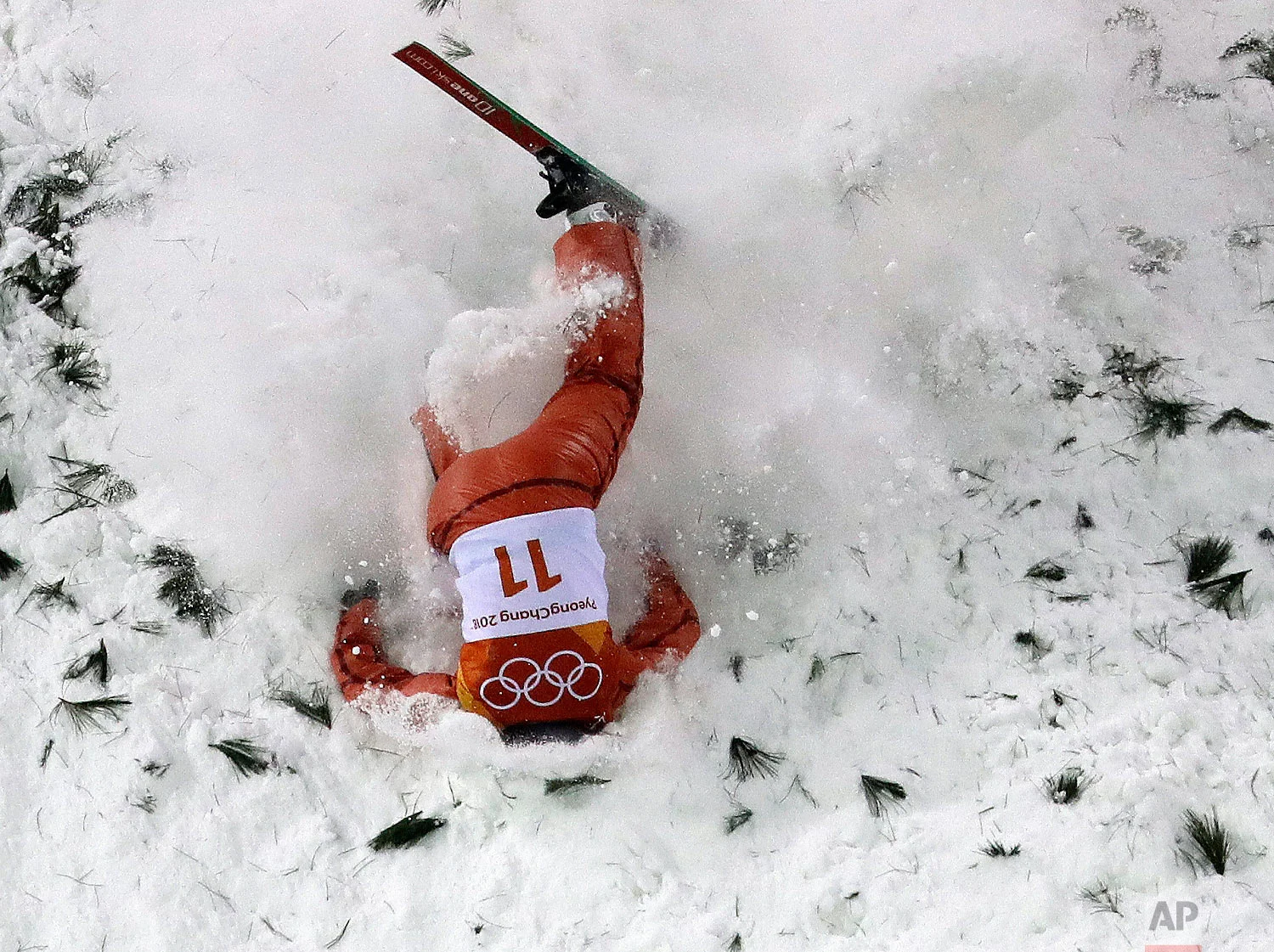 Alla Tsuper, of Belarus, crashes during the women's freestyle aerial final at Phoenix Snow Park at the 2018 Winter Olympics in Pyeongchang, South Korea, Friday, Feb. 16, 2018. (AP Photo/Lee Jin-man)