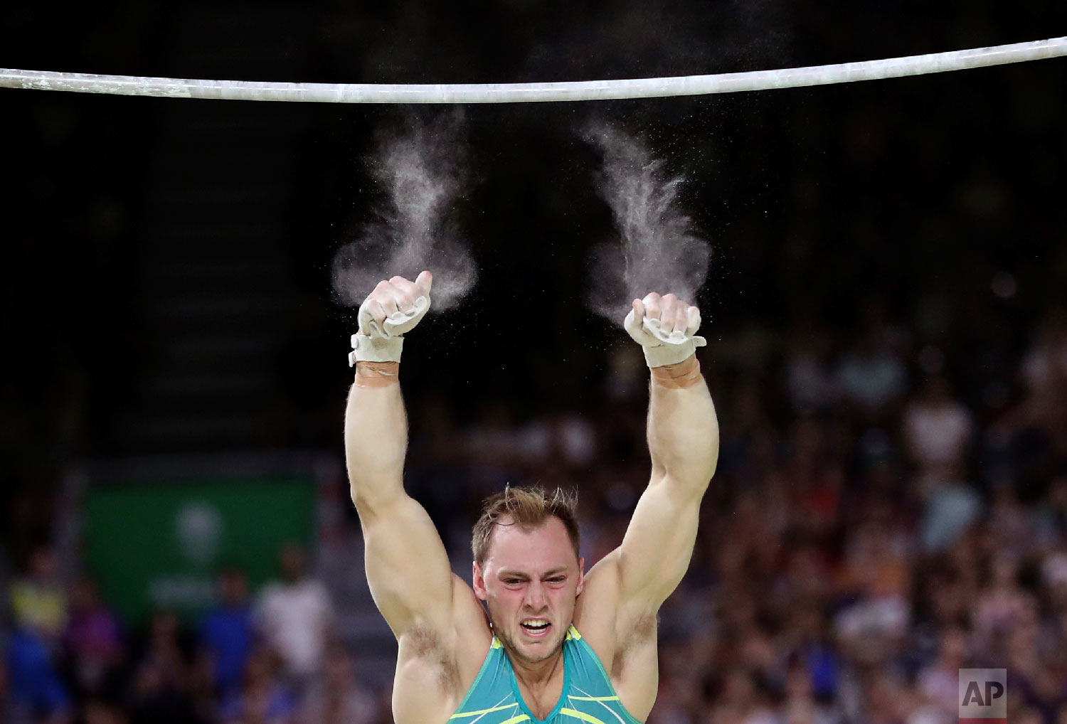  In this April 5, 2018 photo, Australia's Mitchell Morgans falls of the high bar as he competes at the men's artistic gymnastics competition at Coomera Indoor Stadium during the Commonwealth Games on the Gold Coast, Australia. (AP Photo/Dita Alangkar