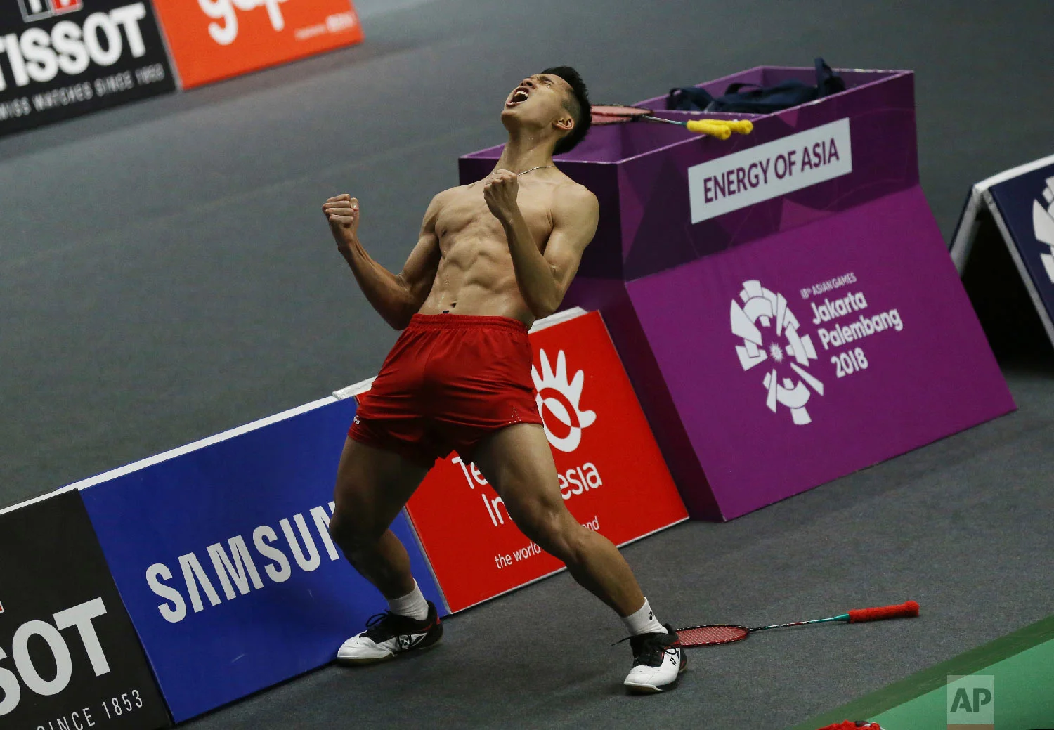 Jonatan Christie of Indonesia celebrates after defeating Kenta Nishimoto of Japan during their men's single semifinals badminton match at the 18th Asian Games in Jakarta, Indonesia, Monday, Aug. 27, 2018. (AP Photo/Achmad Ibrahim)