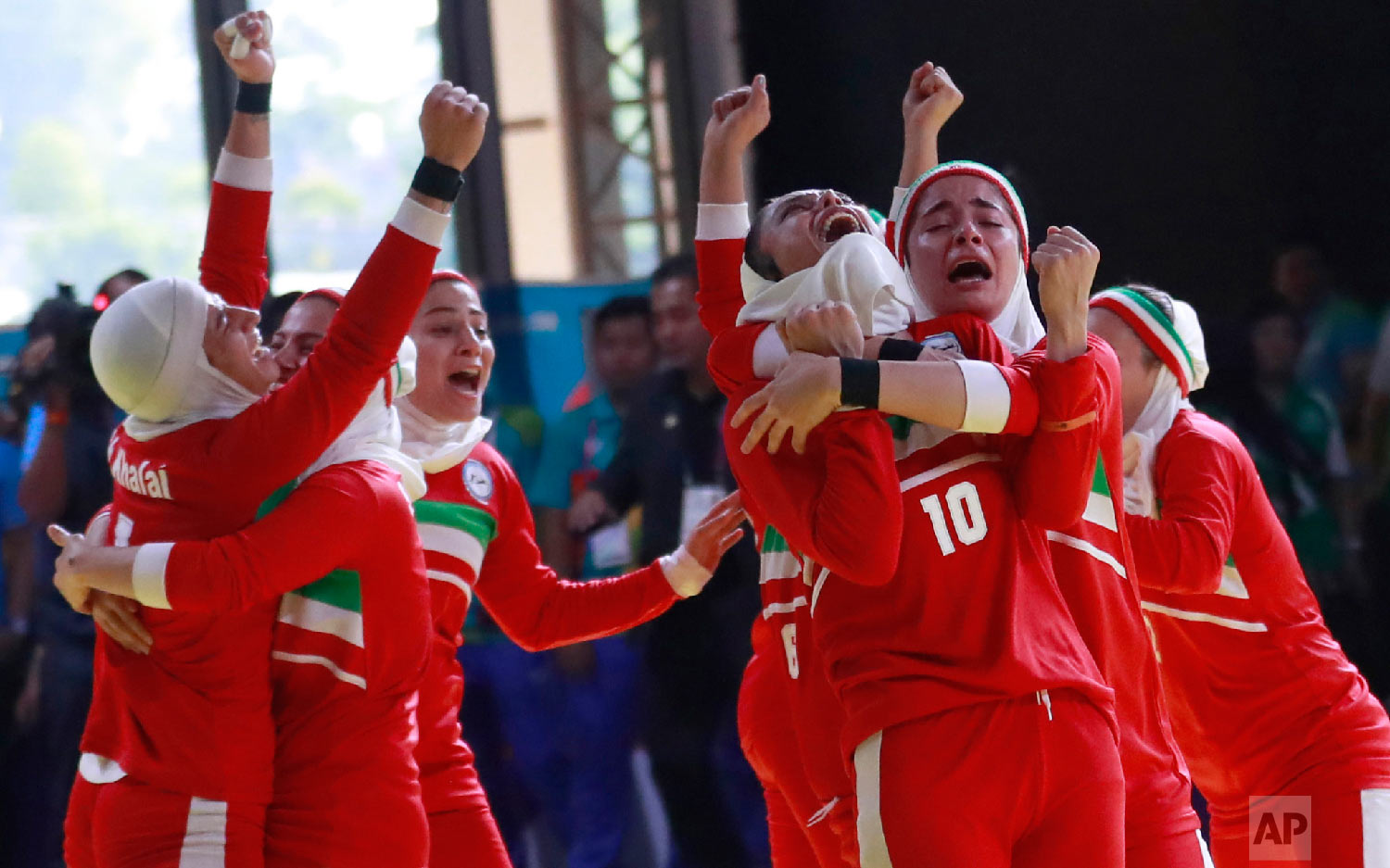  Iran's team, in red, react after defeating India's during at the women's team Kabaddi gold medal match at the 18th Asian Games in Jakarta, Indonesia, Friday, Aug. 24, 2018. Iran won gold.(AP Photo/Tatan Syuflana) 