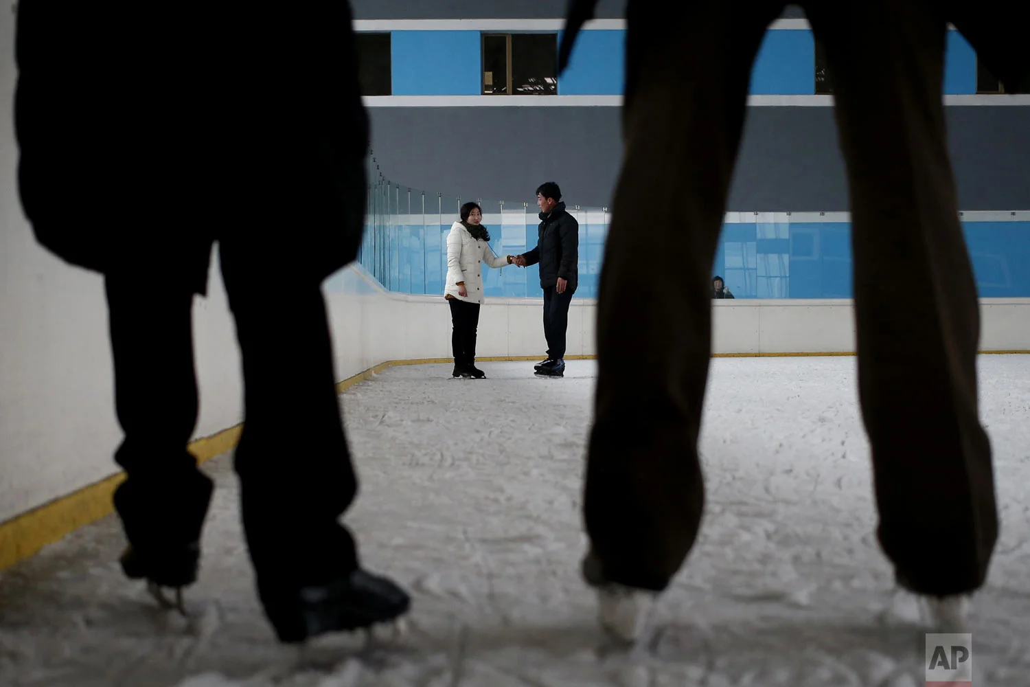 Couples skate on an ice rink in Pyongyang, North Korea, on Tuesday, Dec. 18, 2018. (AP Photo/Dita Alangkara)