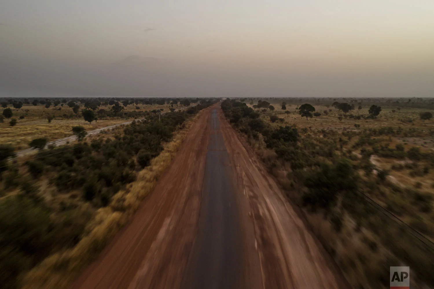An aerial view of the road that connects Senegal to Mali is seen, Nov. 28, 2018, near Tambacounda, Senegal. (AP Photo/Felipe Dana)