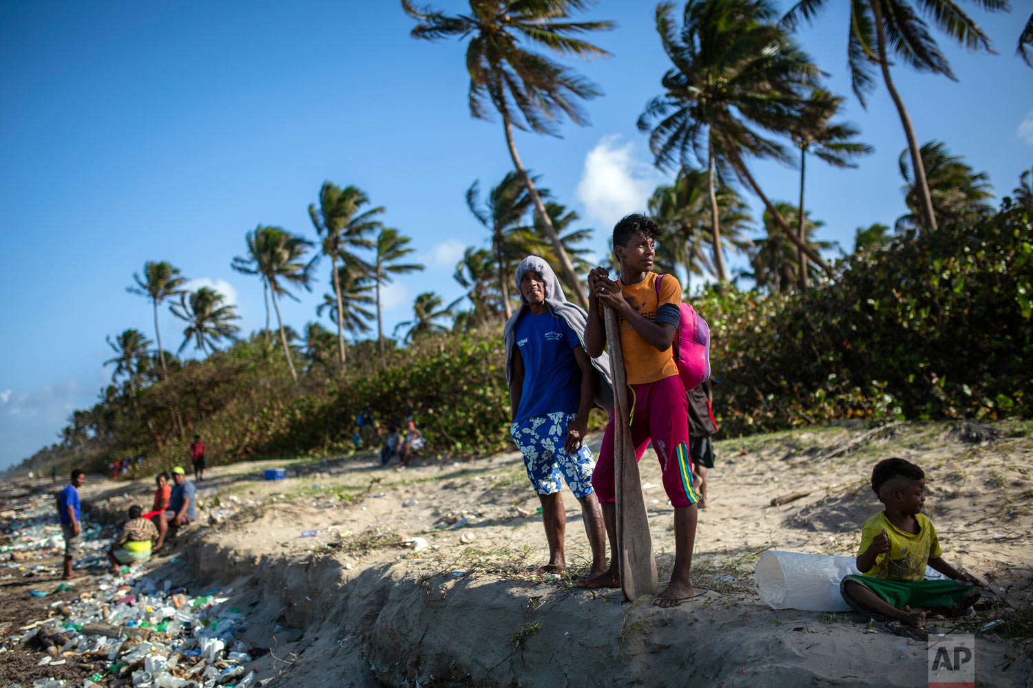  In this Feb. 10, 2018 photo, Miskito divers wait to board a boat for a two week fishing trip to harvest sea cucumbers, in Krata, Honduras. (AP Photo/Rodrigo Abd) 