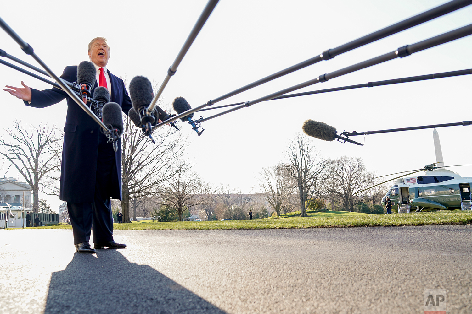 President Donald Trump speaks to reporters before boarding Marine One on the South Lawn of the White House in Washington, Tuesday, March 13, 2018, to travel to Andrews Air Force Base, Md. (AP Photo/Andrew Harnik)