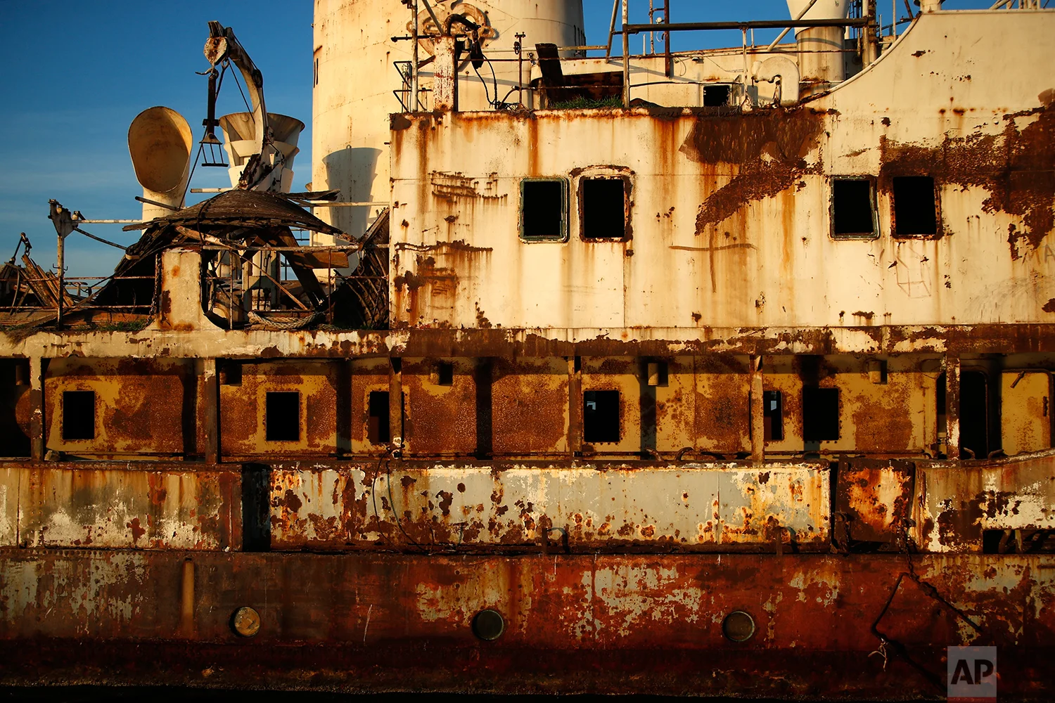 In this Friday, Dec. 4, 2018 photo, an abandoned ship is tied up in the Gulf of Elefsina, west of Athens. (AP Photo/Thanassis Stavrakis)