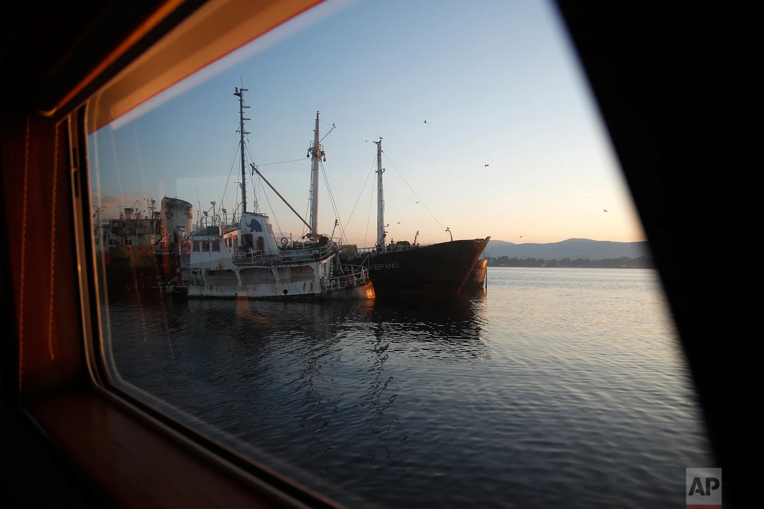 In this Friday, Dec. 4, 2018 photo, abandoned ships are moored in the Gulf of Elefsina, west of Athens. (AP Photo/Thanassis Stavrakis)