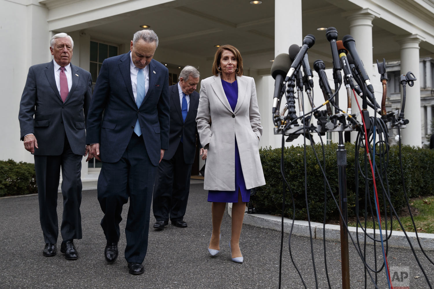  From left, House Majority Leader Steny Hoyer of Md., Senate Minority Leader Chuck Schumer of N.Y., Sen. Dick Durbin, D-Ill., and Speaker of the House Nancy Pelosi of Calif., walk to speak to reporters after meeting with President Donald Trump about 