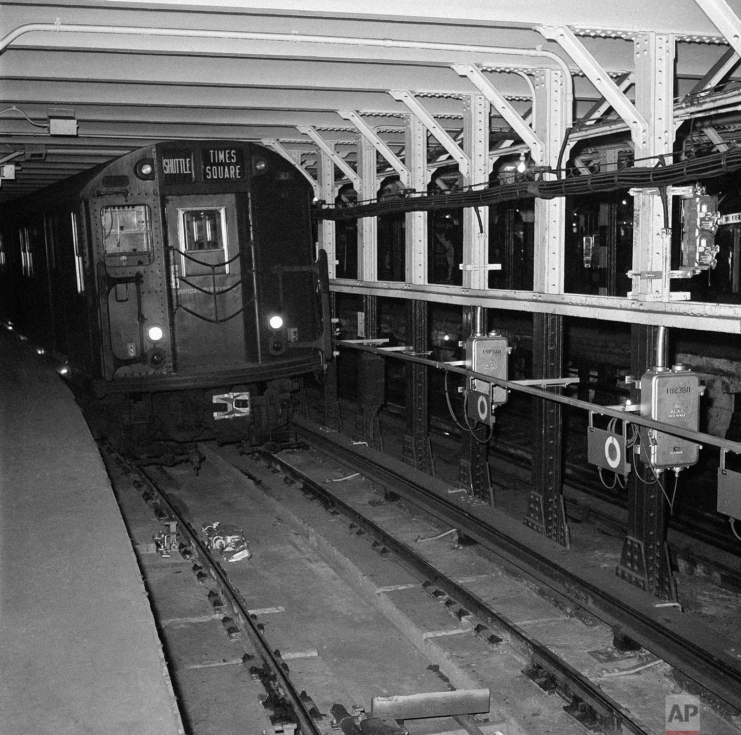  This is a head-on view of the automated subway shuttle train, scheduled to operate between Grand Central Station on New York's East Side and Times Square on the West Side of Manhattan, Dec. 13, 1961. The train is slowing to a stop at the Times Squar