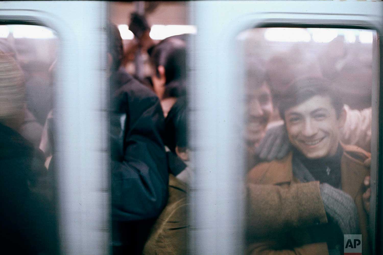  Some passengers show good humor as they pack themselves like sardines in a subway car at the height of the rush hour in New York City, 1966. (AP Photo) 