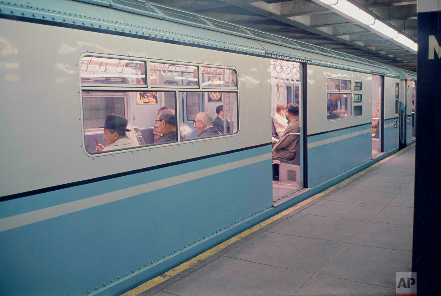  A New York City subway train, the Manhattan-bound number 7, is pictured on the Main Street, Queens platform with doors open waiting for passengers, 1966. (AP Photo) 