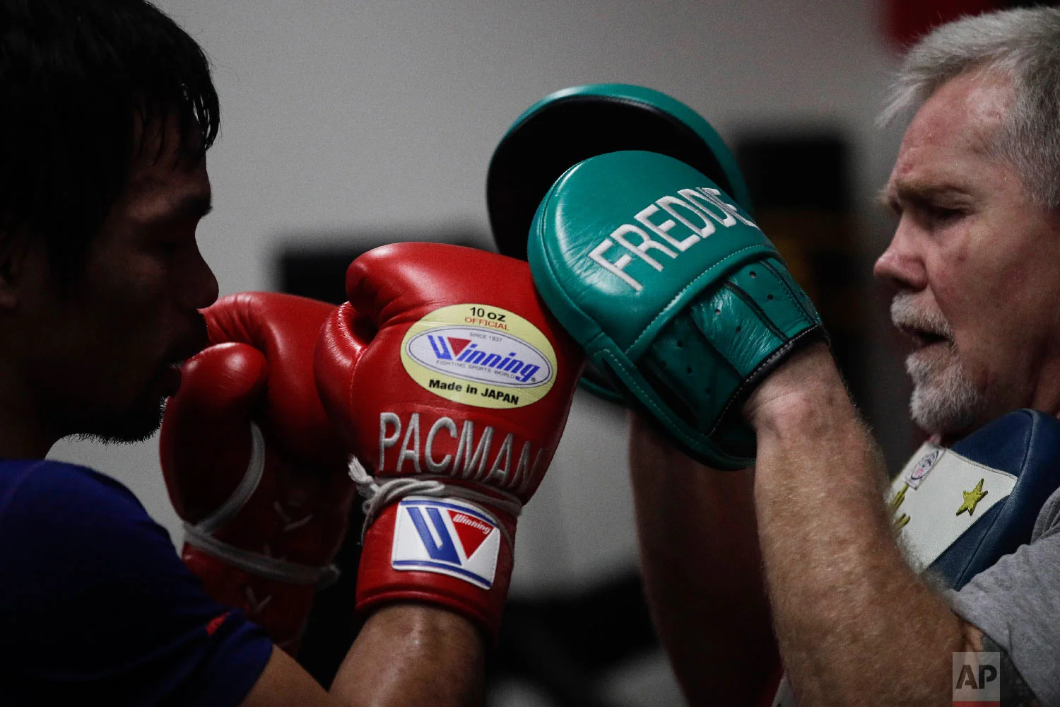 Boxer Manny Pacquiao, left, trains with Freddie Roach at the Wild Card Boxing Club on Jan. 14, 2019, in Los Angeles. (AP Photo/Jae C. Hong)