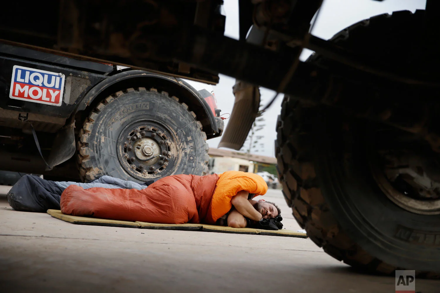 A competitors sleeps in Peru, Jan. 11, 2019. (AP Photo/Ricardo Mazalan)