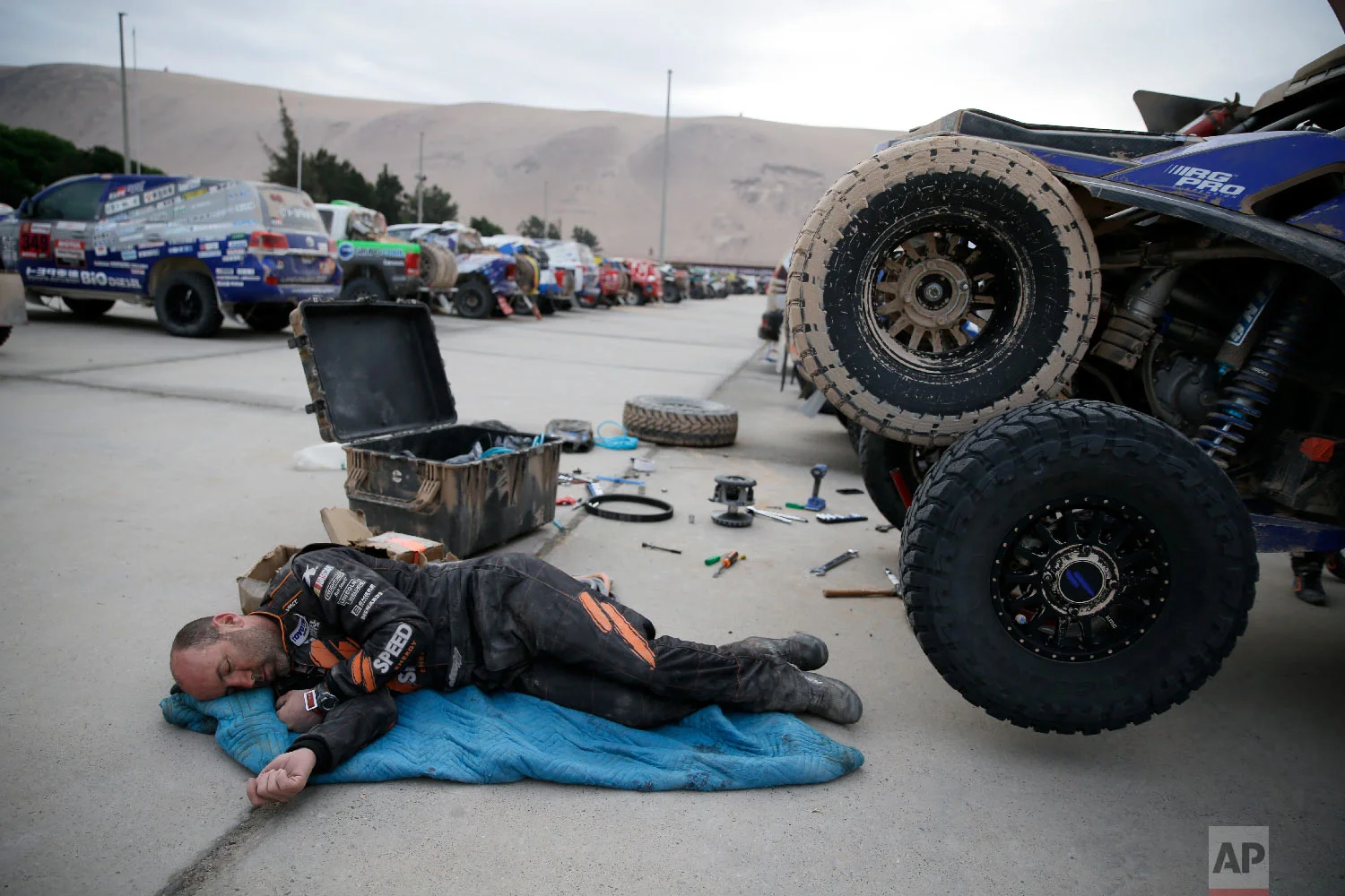 Co-driver Bill Conger, of United States, rests in Peru, Jan. 11, 2019. (AP Photo/Ricardo Mazalan)