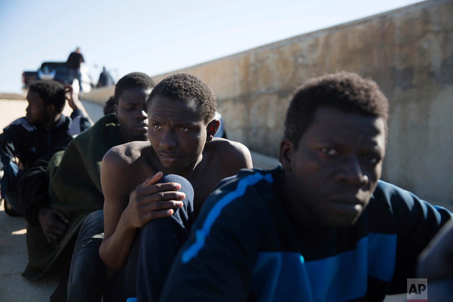  Migrants rest on the sidewalk port of Tripoli they were rescued by the Coast Guard off the coast of Tripoli, Libya, March 3, 2017.  (AP Photo/Mohamed Ben Khalifa) 