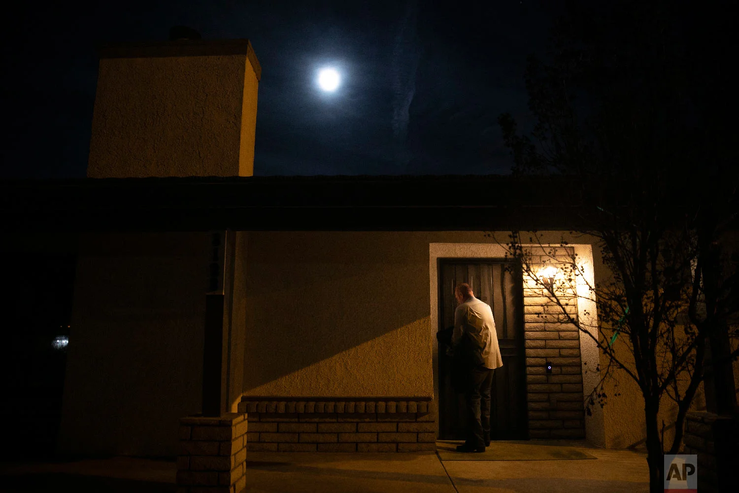 Chris George, a federal employee furloughed from his job as a forestry technician supervisor for the U.S. Department of Agriculture Forest Service, leaves his home for a free meal offered to federal workers affected by the government shutdown Saturday, Jan. 19, 2019, in Hemet, Calif. (AP Photo/Jae C. Hong)