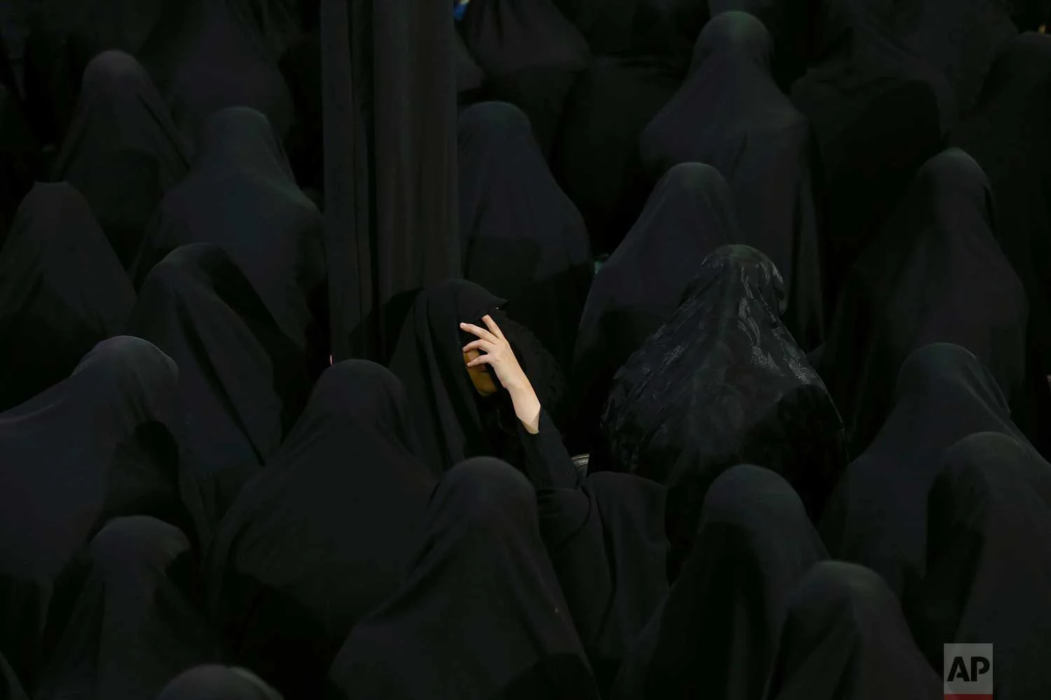 Muslim Shiite women mourn during the holy day of Ashoura, at the Sadat Akhavi Mosque in Tehran, Iran, Thursday, Sept 20, 2018. Ashoura is the annual Shiite commemoration of the death of Imam Hussein, the grandson of the Prophet Muhammad, at the Battle of Karbala in present-day Iraq in the 7th century. (AP Photo/Ebrahim Noroozi)