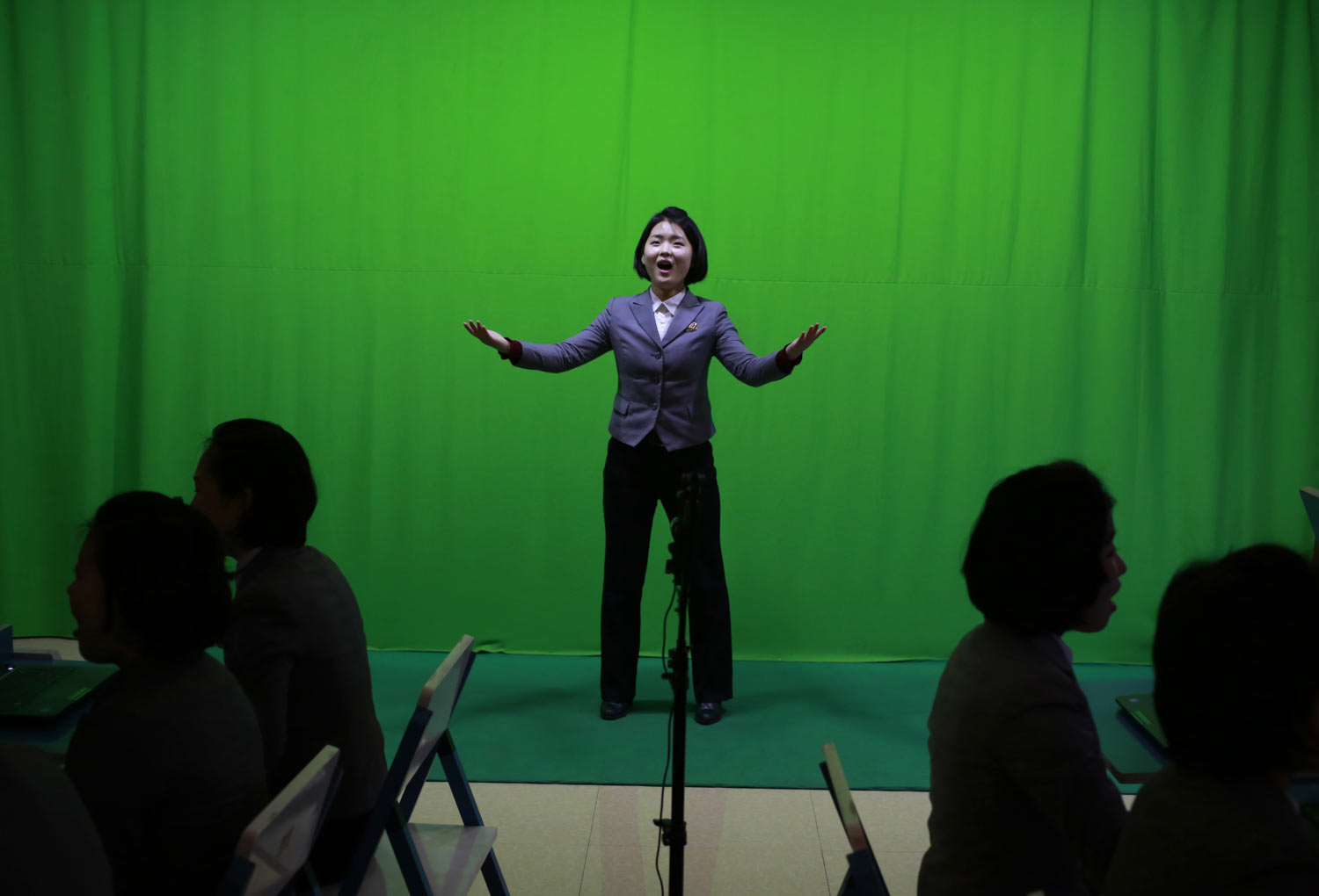 A student sings in front of a green screen during a computer graphics class at Pyongyang Teachers' University, a teacher training college, in Pyongyang, North Korea, on Tuesday, Jan. 29, 2019. (AP Photo/Dita Alangkara)