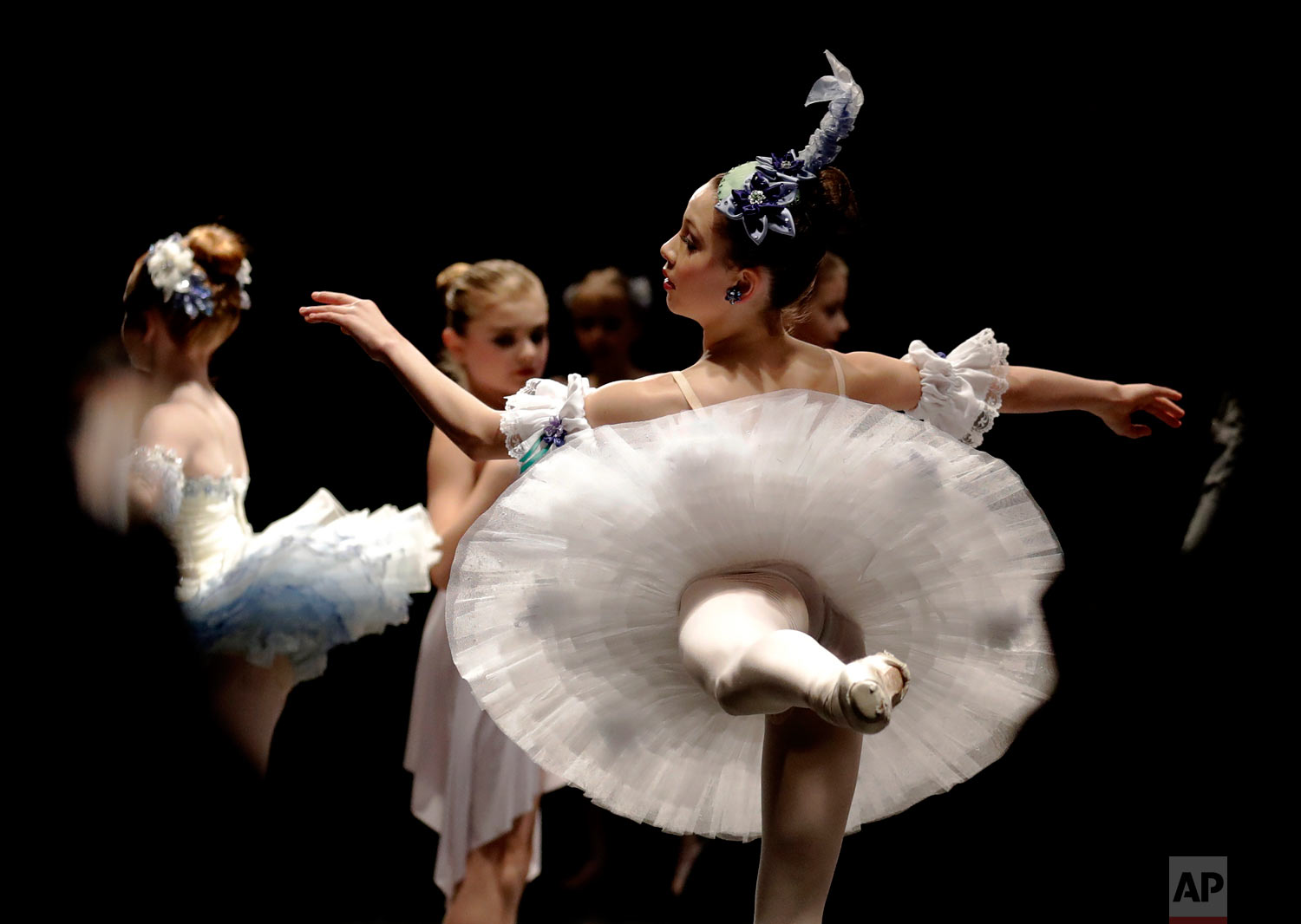  Eva Balicki, right, and young ballet dancers warm up for the Youth America Grand Prix North America regional semi-finals in River Forest, Ill. (AP Photo/Nam Y. Huh) 