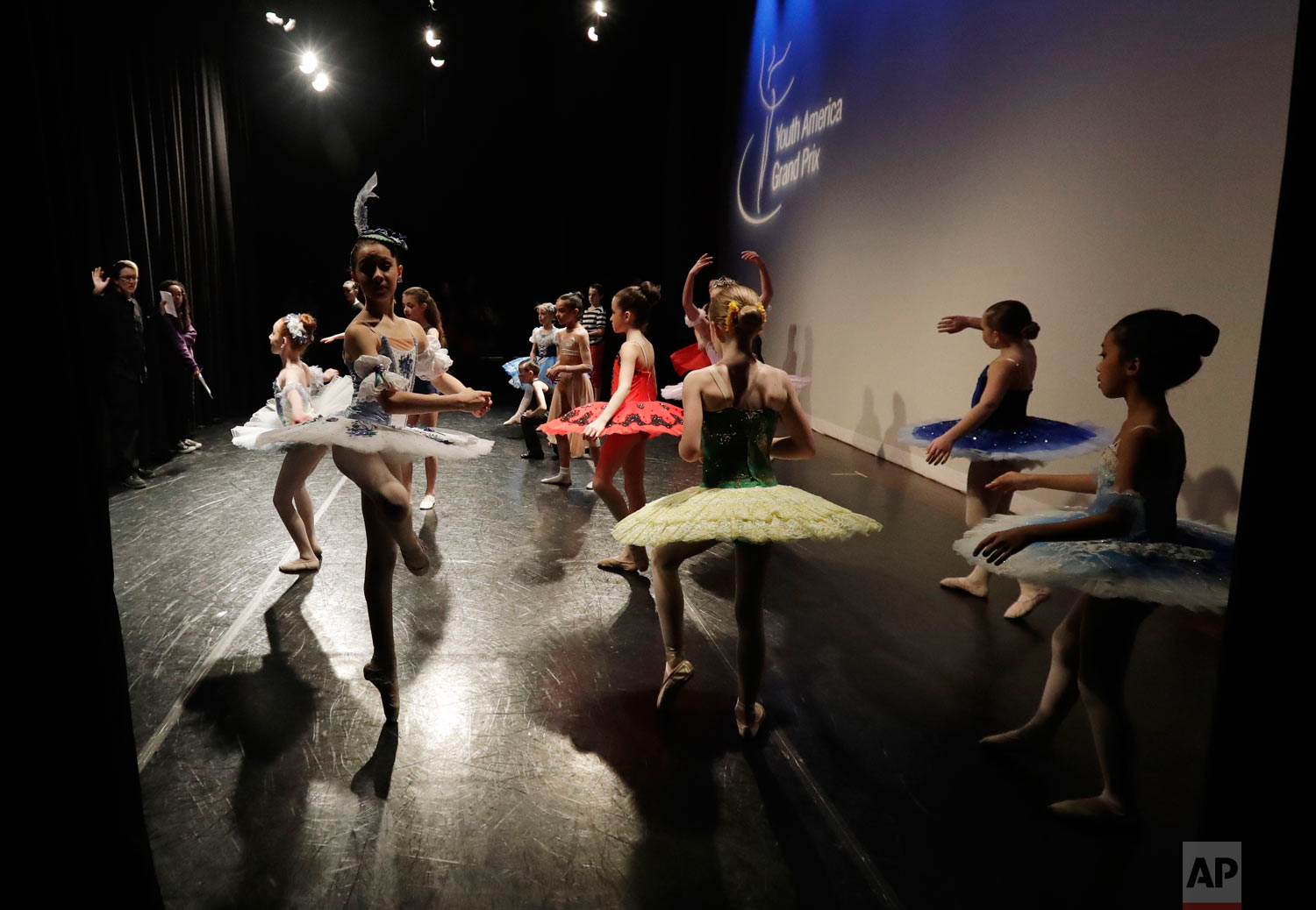  Young dancers warm up for the Youth America Grand Prix North America regional semi-finals at Dominican University Performing Arts Center in River Forest, Ill. (AP Photo/Nam Y. Huh) 