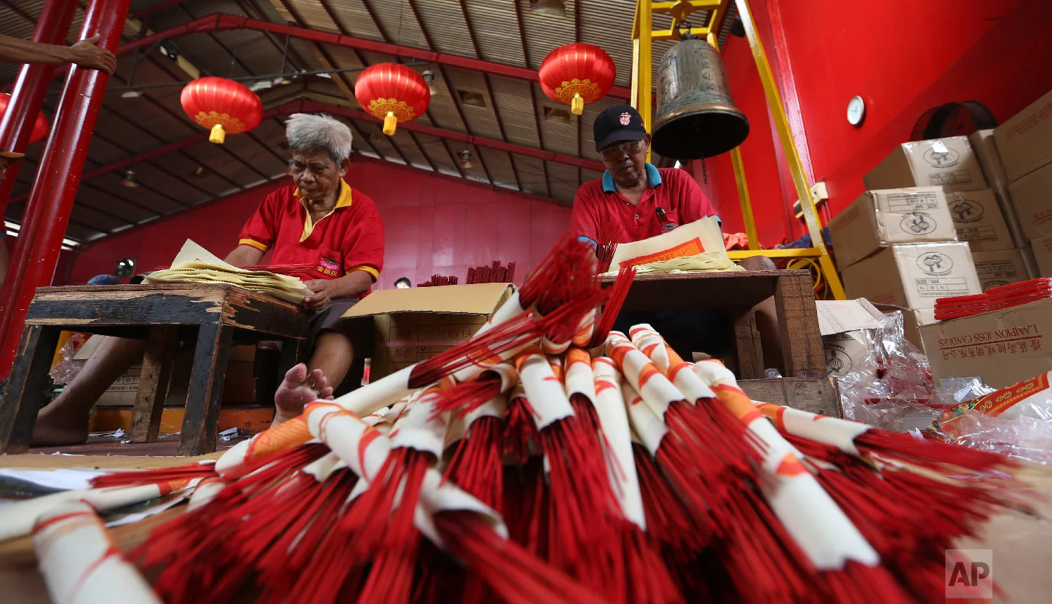 Workers prepare for the Lunar New Year at the Dharma Bakti Temple in Chinatown area of Jakarta, Indonesia, Monday, Jan. 28, 2019. (AP Photo/ Achmad Ibrahim)
