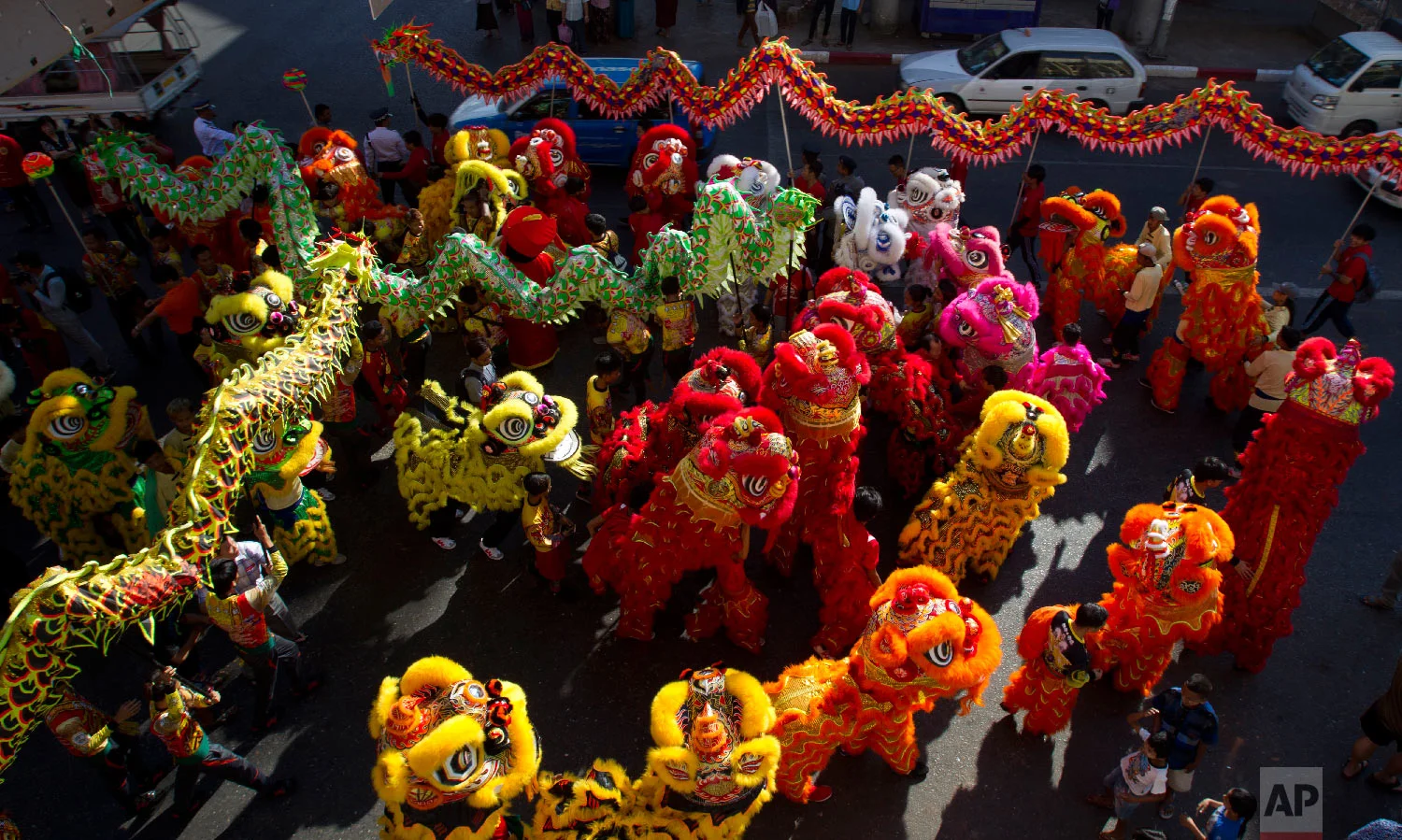 Multiple dragon dances take part in Lunar New Year celebrations in the Chinatown area of Yangon, Myanmar, Tuesday, Feb. 5, 2019. (AP Photo/Thein Zaw)