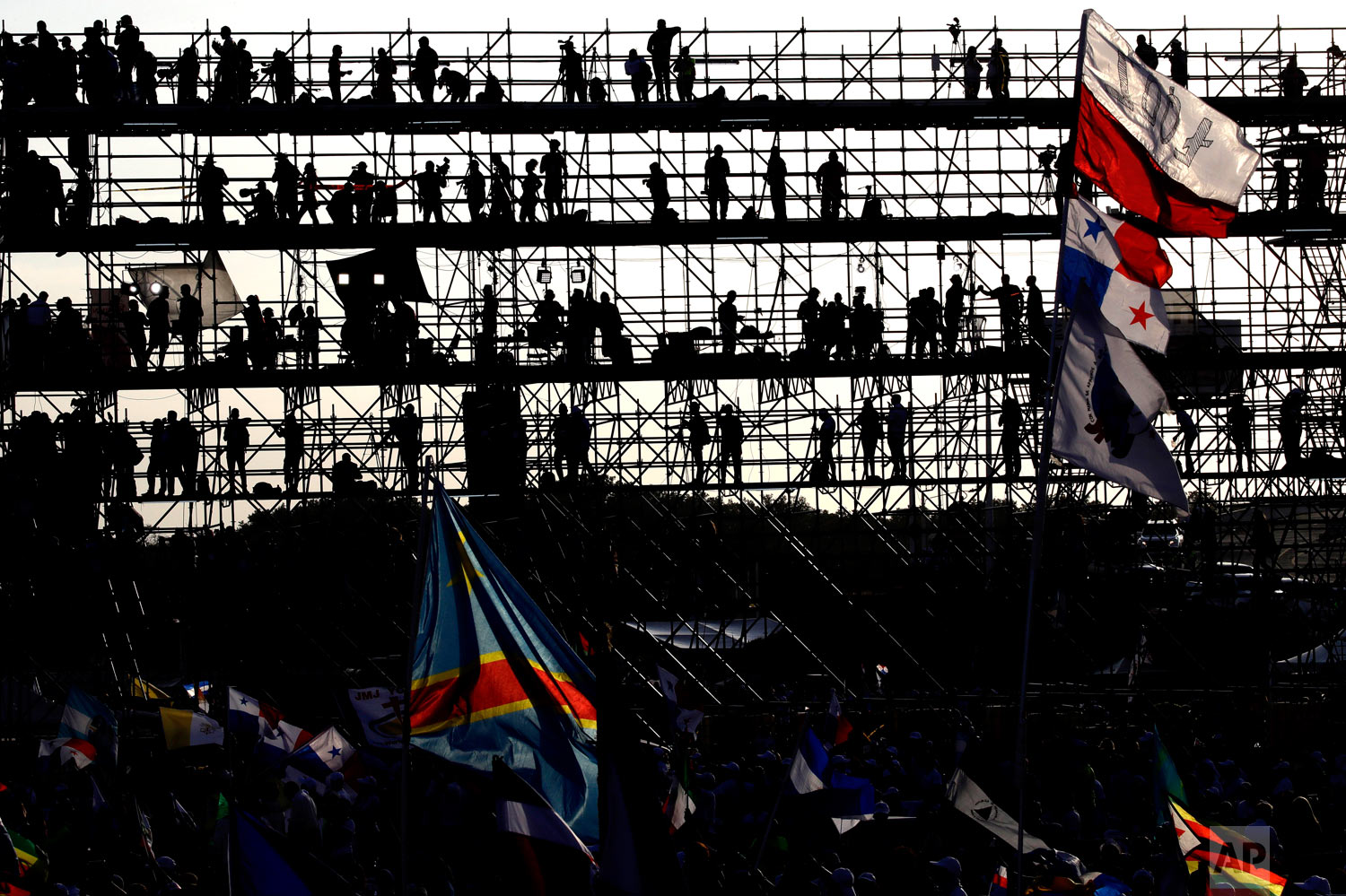  Journalists standing on a press scaffolding are silhouetted against the morning sky as they wait for Pope Francis to celebrate Mass in Panama City, Jan. 27, 2019. (AP Photo/Alessandra Tarantino) 