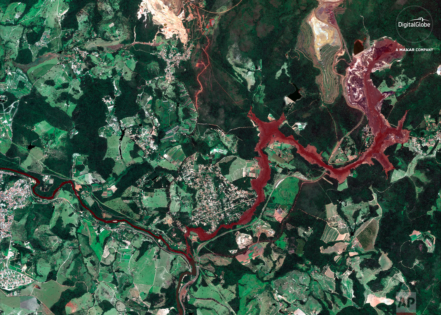  This Jan. 29, 2019 satellite image provided by DigitalGlobe shows mud flooding an area days after a Vale mine dam collapsed on Jan. 25, near Brumadinho, Brazil. (DigitalGlobe, a Maxar company via AP) 