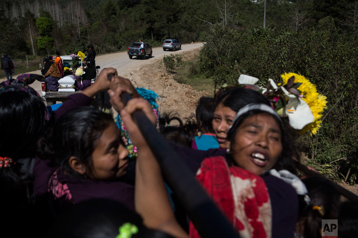  Women travel in the back of a truck during the funeral procession for Felipe Gomez Alonzo to the cemetery in Yalambojoch, Guatemala, Jan. 27, 2019. On Christmas Eve, the 8-year-old boy became the second Guatemalan child to die while in U.S. custody 