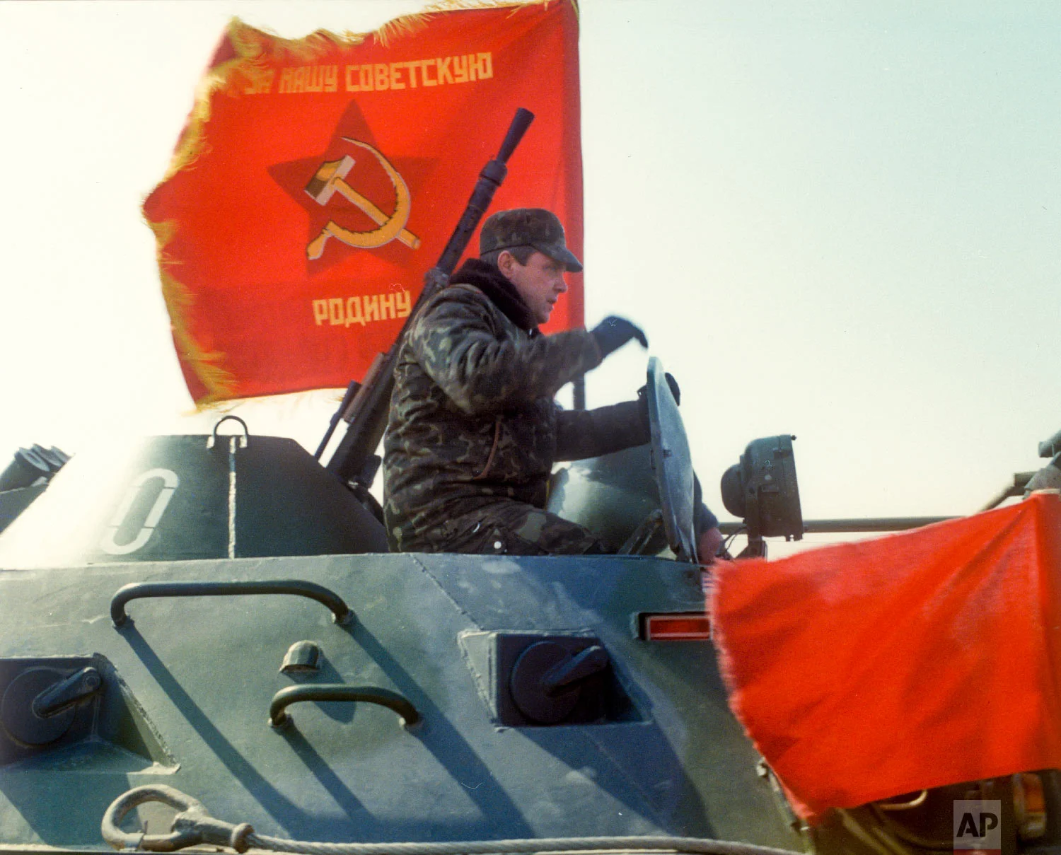 Lt. Gen. Boris Gromov, sits atop of an armored personnel carrier driving from Afghanistan across a bridge over the Amy Darya River, at Termez, Uzbekistan on Feb. 15, 1989. (Leonid Yakutin/Defense Ministry Press Service via AP)