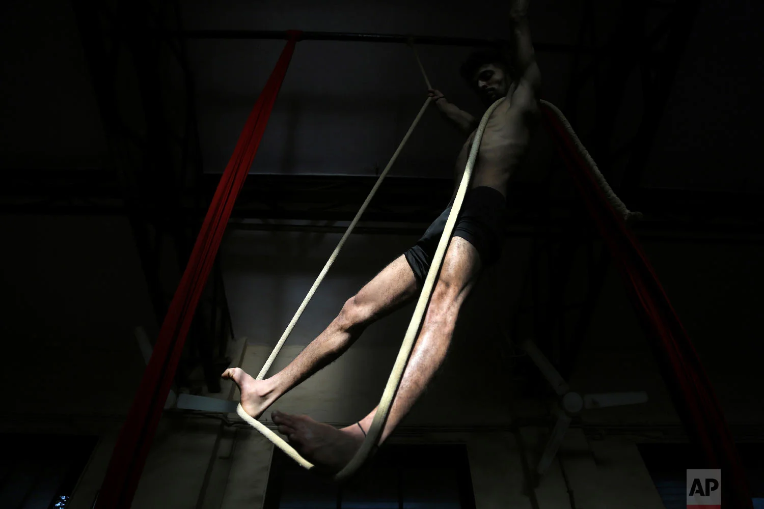 A player performs a rope version of mallakhamb at the Shree Samartha Vyayam Mandir at Shivaji Park in Mumbai, India. (AP Photo/Rafiq Maqbool)