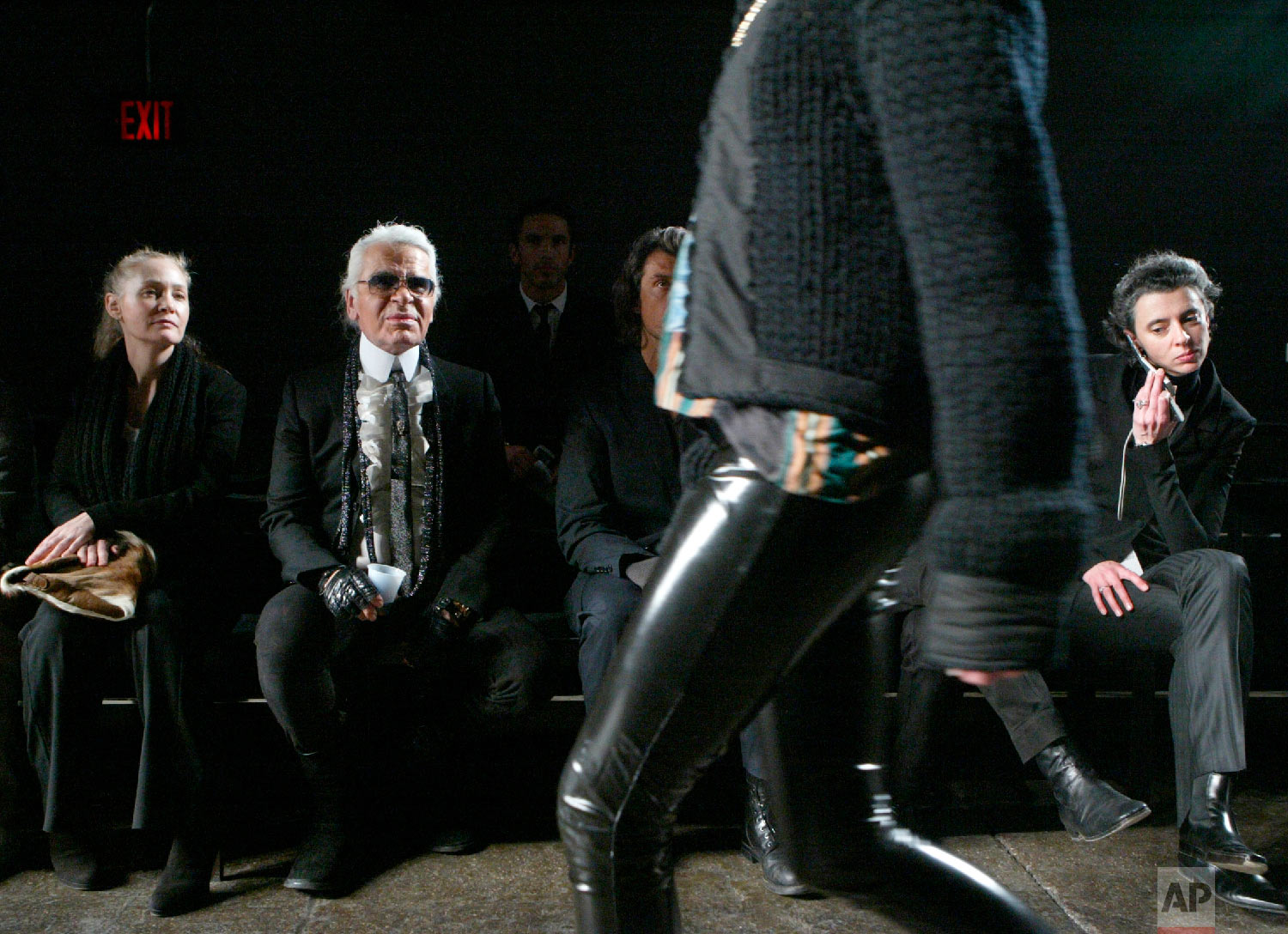 Karl Lagerfeld, second from left, and his creative director Melanie Ward, left, watch a rehearsal before the presentation of his fall 2006 collection on the last day of Fashion Week in New York, Feb. 10, 2006, (AP Photo/Diane Bondareff)