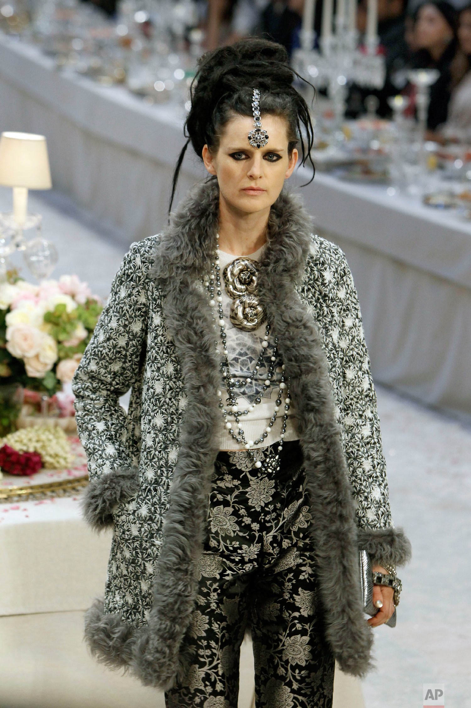 Model Stella Tennant presents a creation by Karl Lagerfeld in Paris, Dec. 6, 2011. (AP Photo/Remy de la Mauviniere)