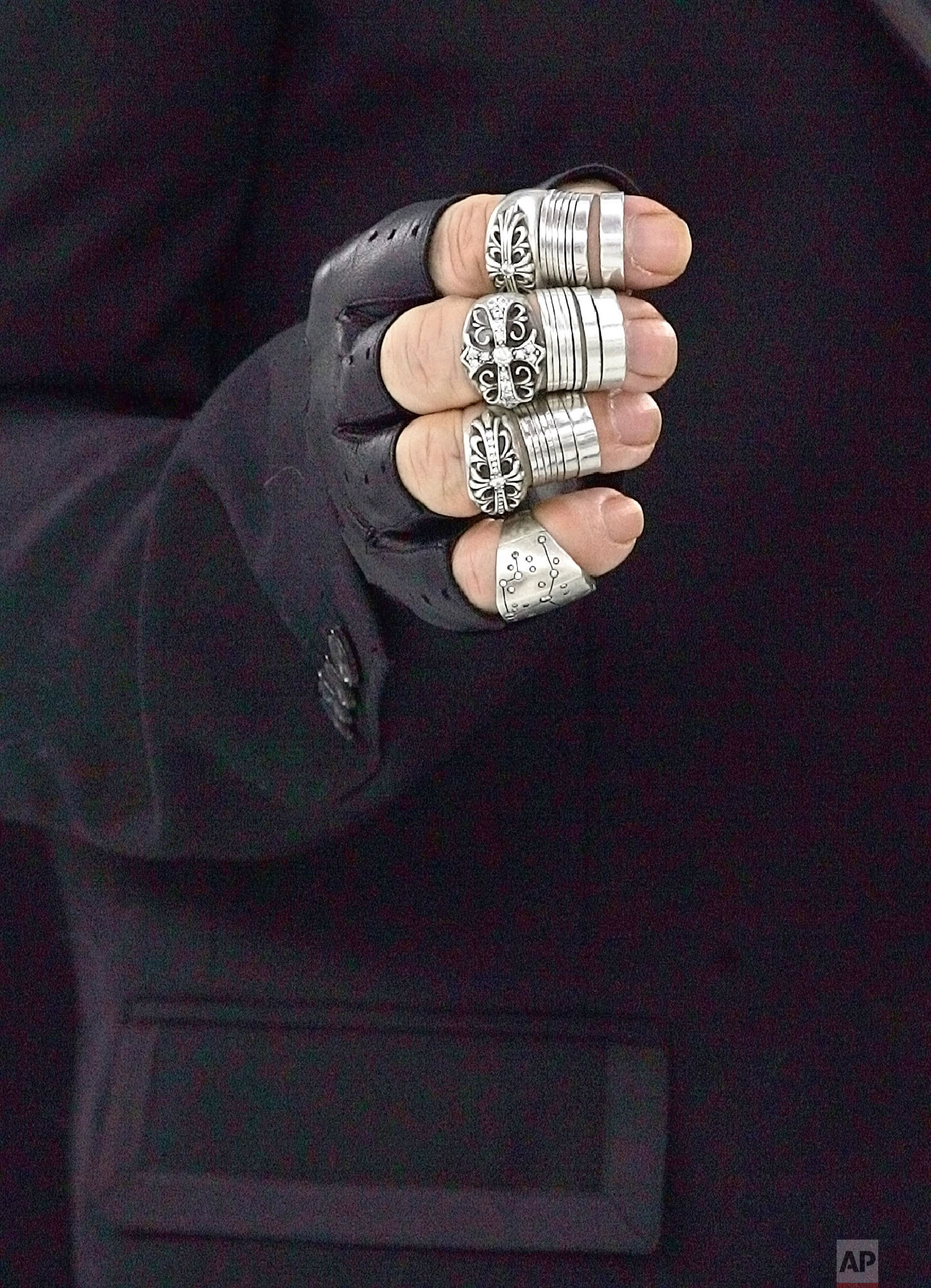 Lagerfeld's hand is seen backstage Jan. 25, 2005 in Paris. (AP Photo/Jerome Delay)