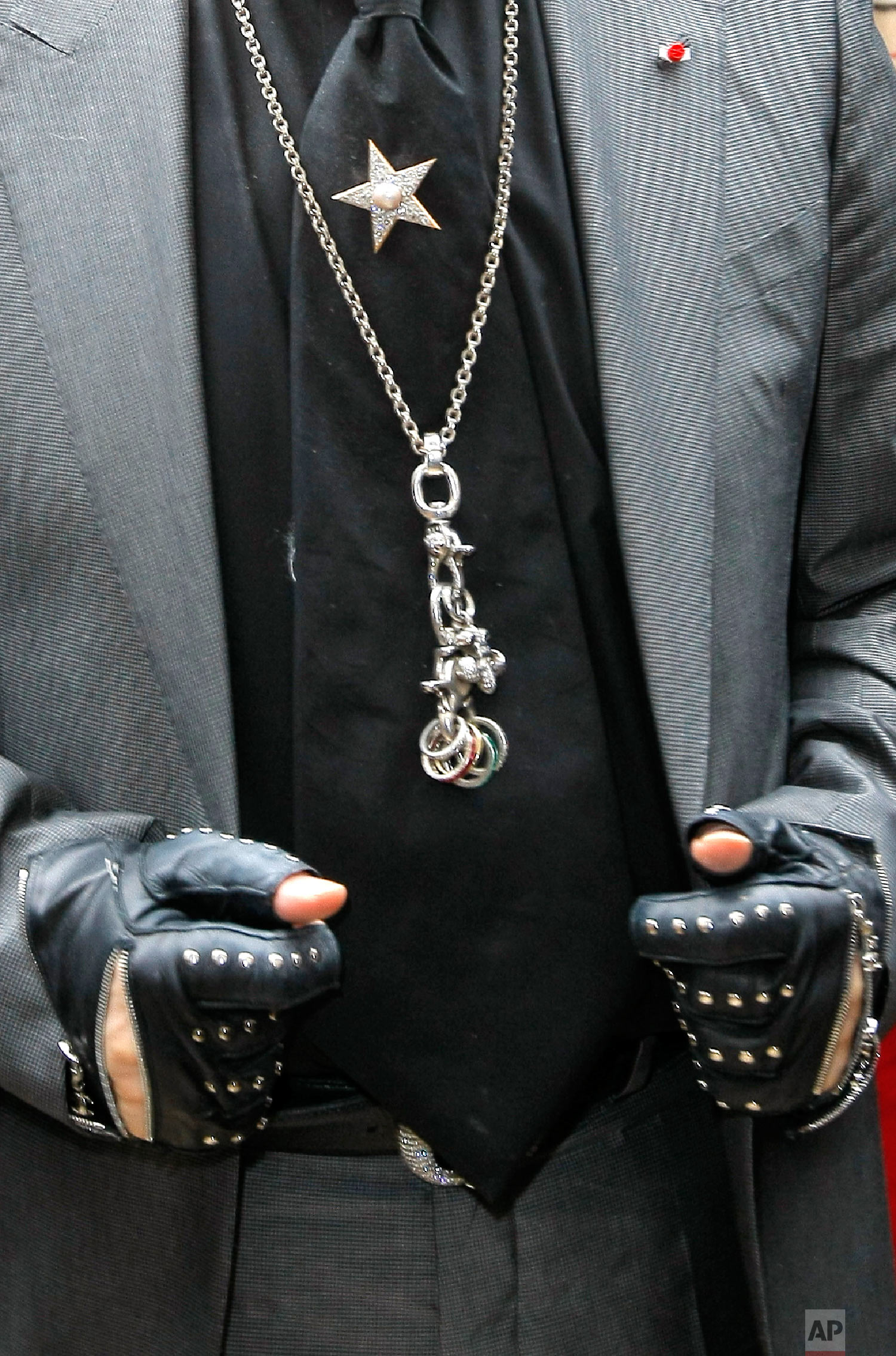 Lagerfeld's arrives to promote a commercial April, 28, 2011 in Paris. (AP Photo/Jacques Brinon)