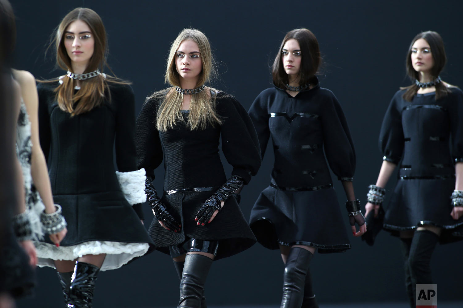Models wear creations by German fashion designer Karl Lagerfeld for Chanel's Fall/Winter 2013-2014 ready to wear collection, in Paris, March, 5, 2013. (AP Photo/Thibault Camus)