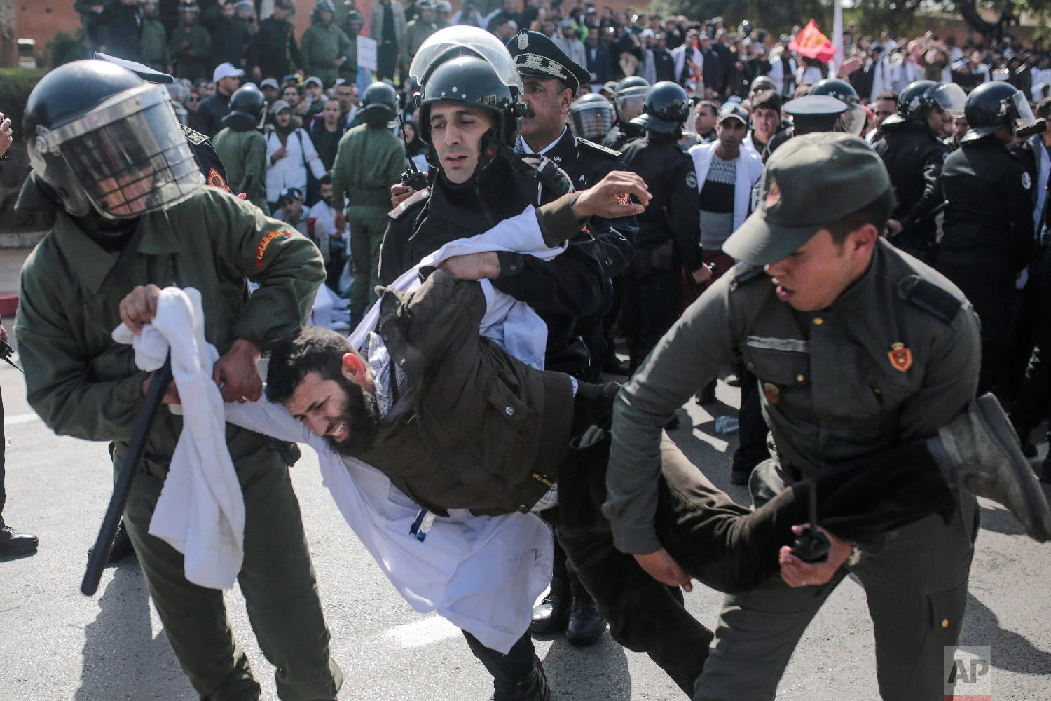 Security forces detain a protesting teacher during a demonstration in Rabat, Morocco, Feb. 20, 2019. (AP Photo/Mosa'ab Elshamy)