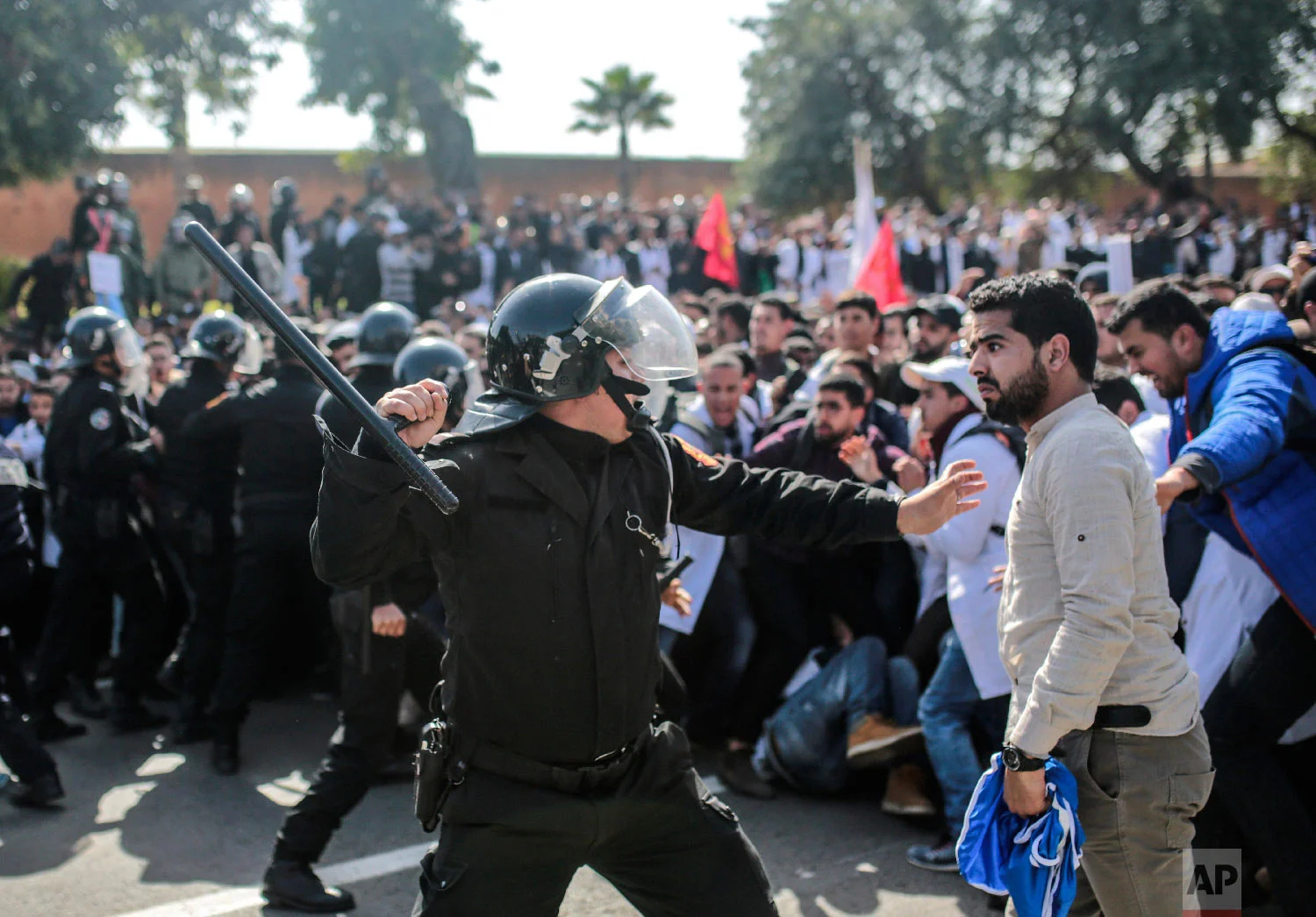 Security forces charge at protesting teachers during a demonstration in Rabat, Morocco, Feb. 20, 2019. (AP Photo/Mosa'ab Elshamy)