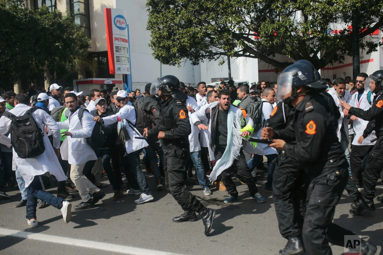 Security forces charge at protesting teachers during a demonstration in Rabat, Morocco, Feb. 20, 2019. (AP Photo/Mosa'ab Elshamy)