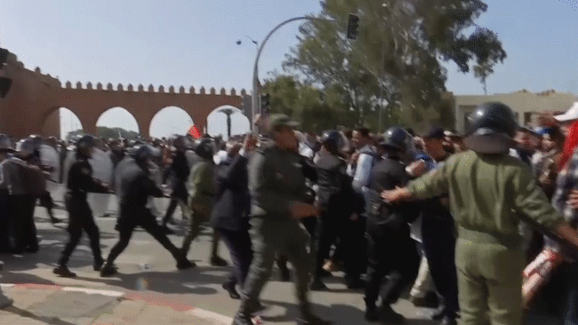 Security forces work during a demonstration in Rabat, Morocco, Feb. 20, 2019. (AP Video/Nadine Achoui-Lesage)