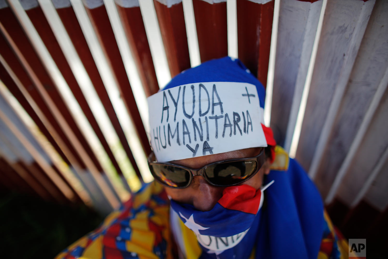  An opposition protester wears the Spanish message on his forehead: "Humanitarian aid now" during a demonstration urging soldiers to allow the entry of U.S. humanitarian aid in Caracas, Venezuela, Saturday, Feb. 23, 2019. (AP Photo/Ariana Cubillos) 