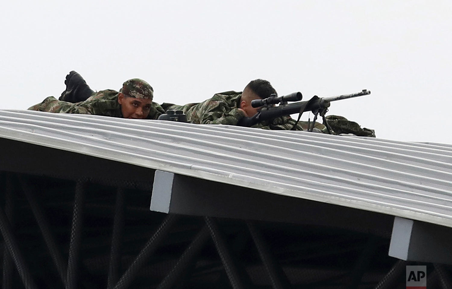  Colombian army snipers cover the Venezuela Aid Live concert on the Colombian side of the Tienditas International Bridge near Cucuta, Colombia, on the border with Venezuela, Friday, Feb. 22, 2019. (AP Photo/Fernando Vergara) 