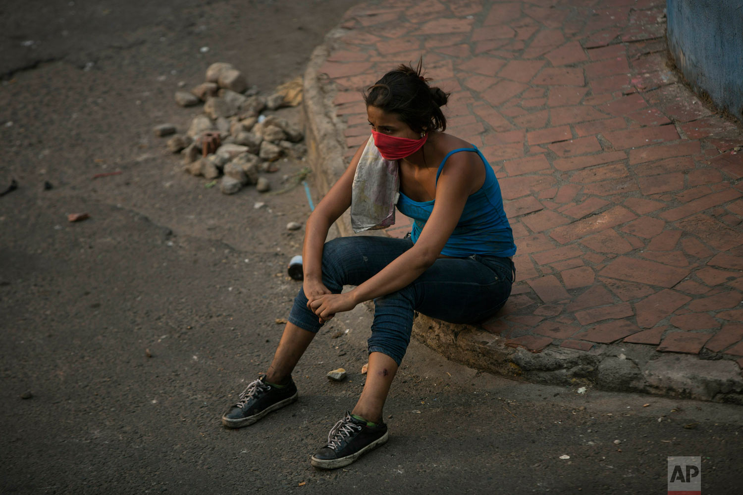  An opposition demonstrator rests after clashing with the Bolivarian National Guard in Urena, Venezuela, near the border with Colombia, Saturday, Feb. 23, 2019. (AP Photo/Rodrigo Abd) 